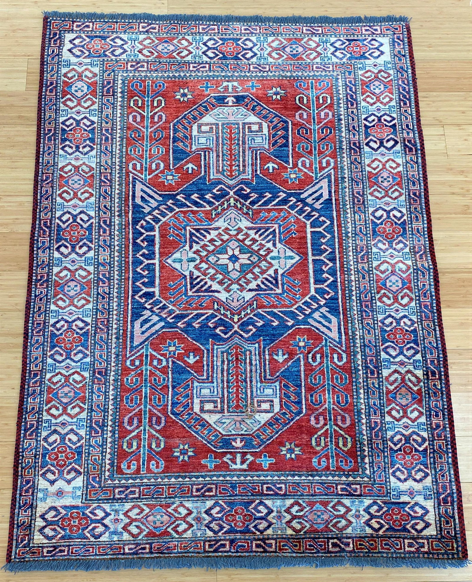 20th Century Kazak Area Rug: Hand knotted Kazag area rug, 20th century; 67" x 47".