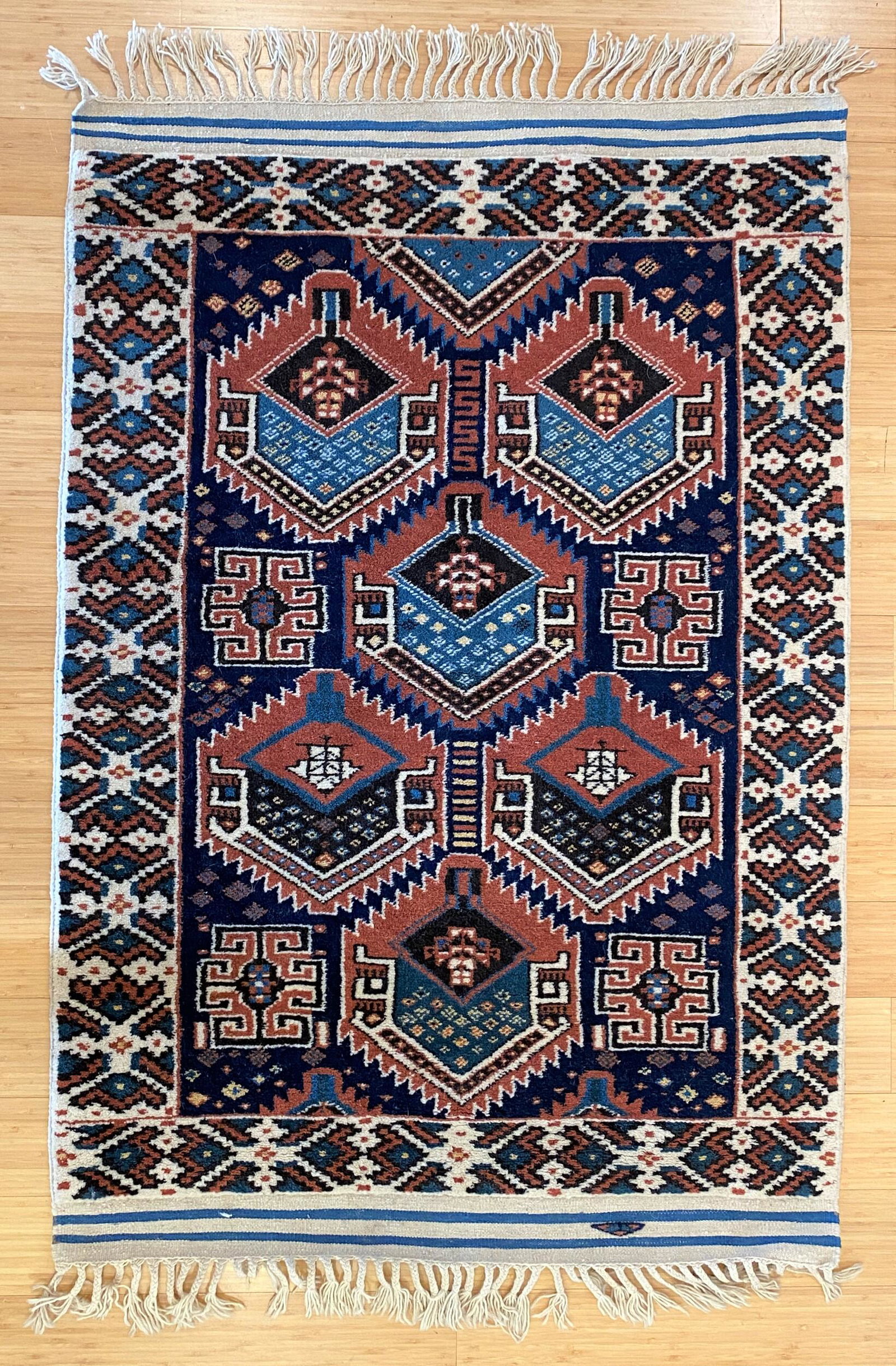 Collection of 6 Kazak Area Rugs, 20th Century: All mid to late 20th century, in varying sizes, and with tassles; largest 70" x 38".