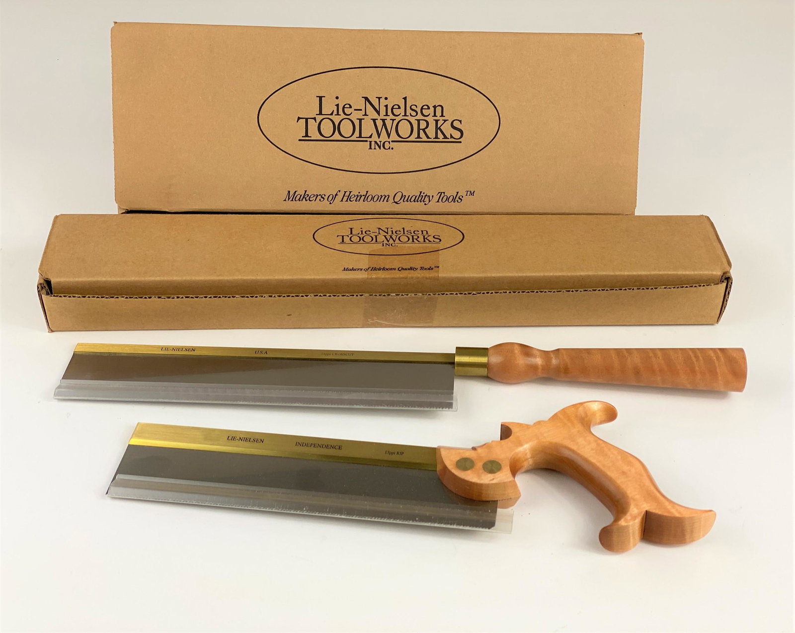 Pair of Brand New in Box Lie-Nielsen Saws: Including the L-N SHDS, 14 ppi crosscut saw, as well as the independence dovetail saw, 15 ppi Rip. Each new in the box.