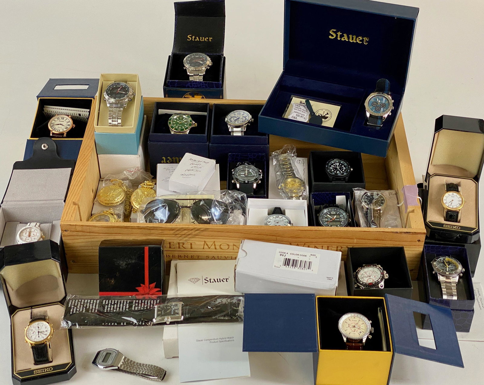 Massive Collection of Watches, New in Box: A large collection of watches and alarm clocks, most new in box. Watches include multiple wristwatches by Stauer, multiple watches by Seiko, Zoppini, 10 pocket watches, a pair of Stauer black flyboy s