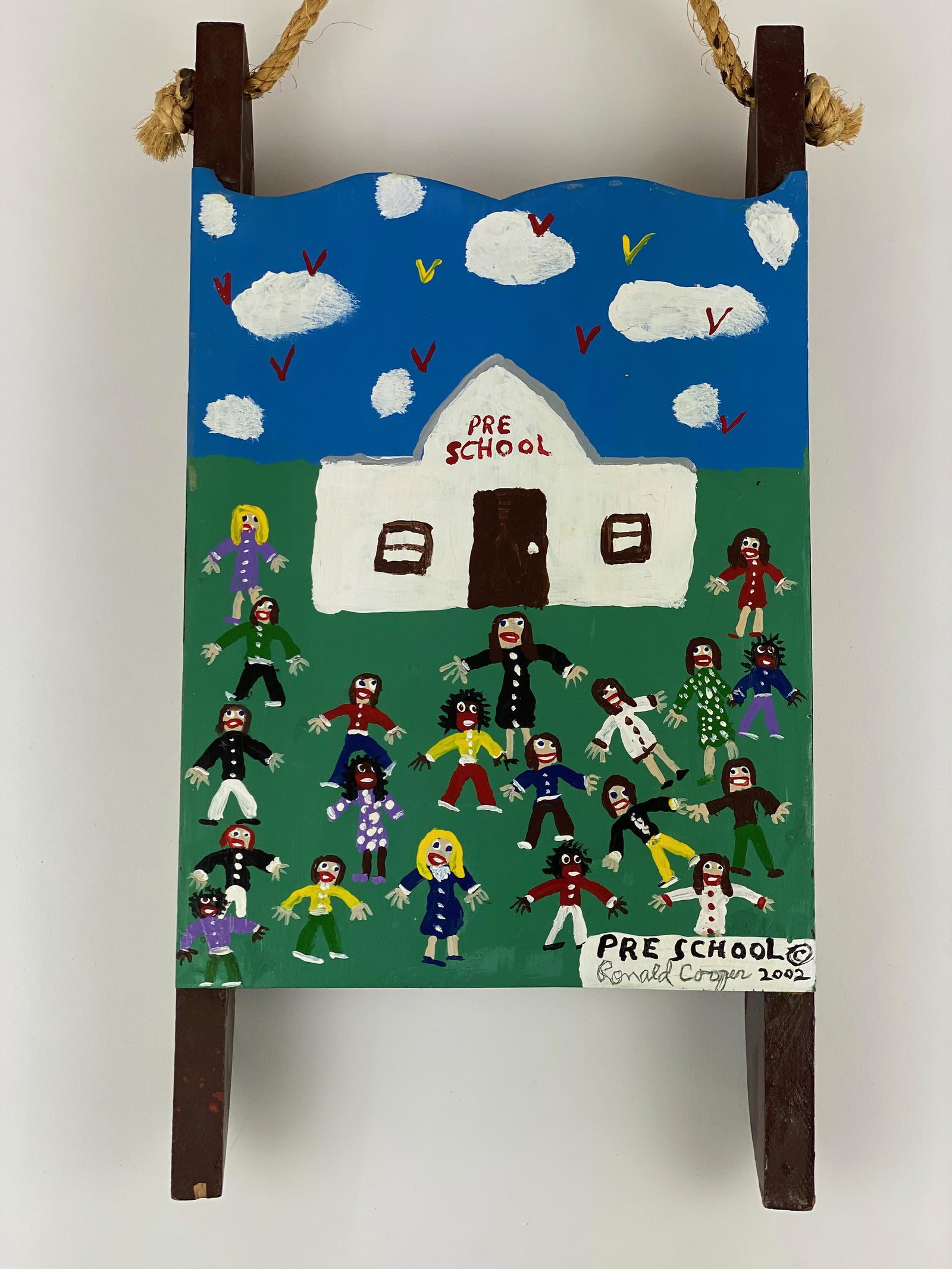Ronald Cooper Folk Art "Pre School" Painted Sled: Ronald Cooper (American, 20th century). A hand painted sled construction, with scene of pre school, signed, titled and dated 2002 to l.r.; 18.5" x 10". With rope hanger. From the collection of Dr. Ger