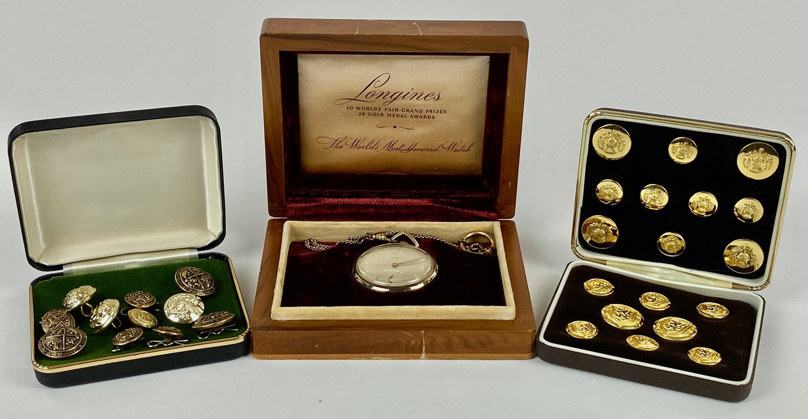 Longines Pocket Watch and Button Sets: A cased, gold-filled Longines pocket watch with gold-filled chain, as well as 2 cases of buttons; watch case 4.25" x 5.5".