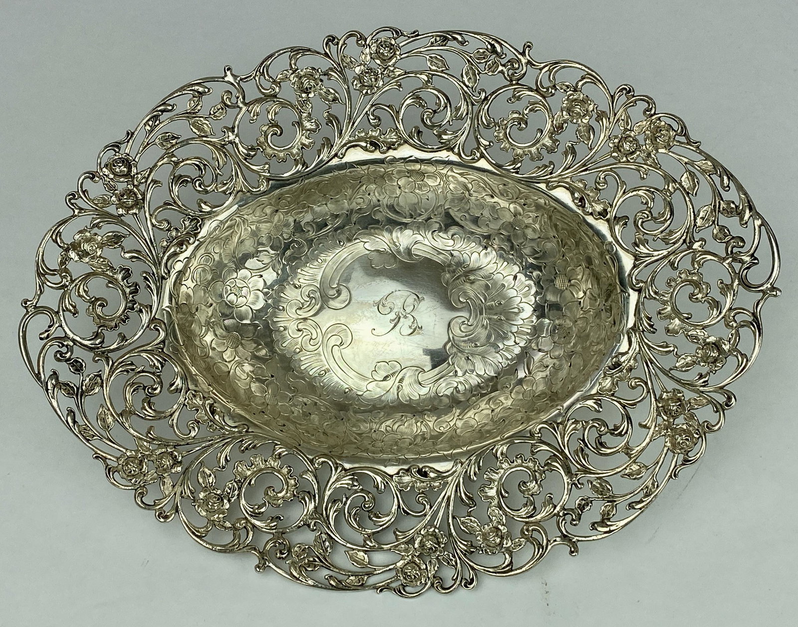 Fine Gorham Reticulated and Incised Sterling Bowl: Gorham Mfg., a sterling silver bowl with piered edge in the form of roses, and incised interior, marked to the underside; 9.5" x 12". 17.81 ozt.