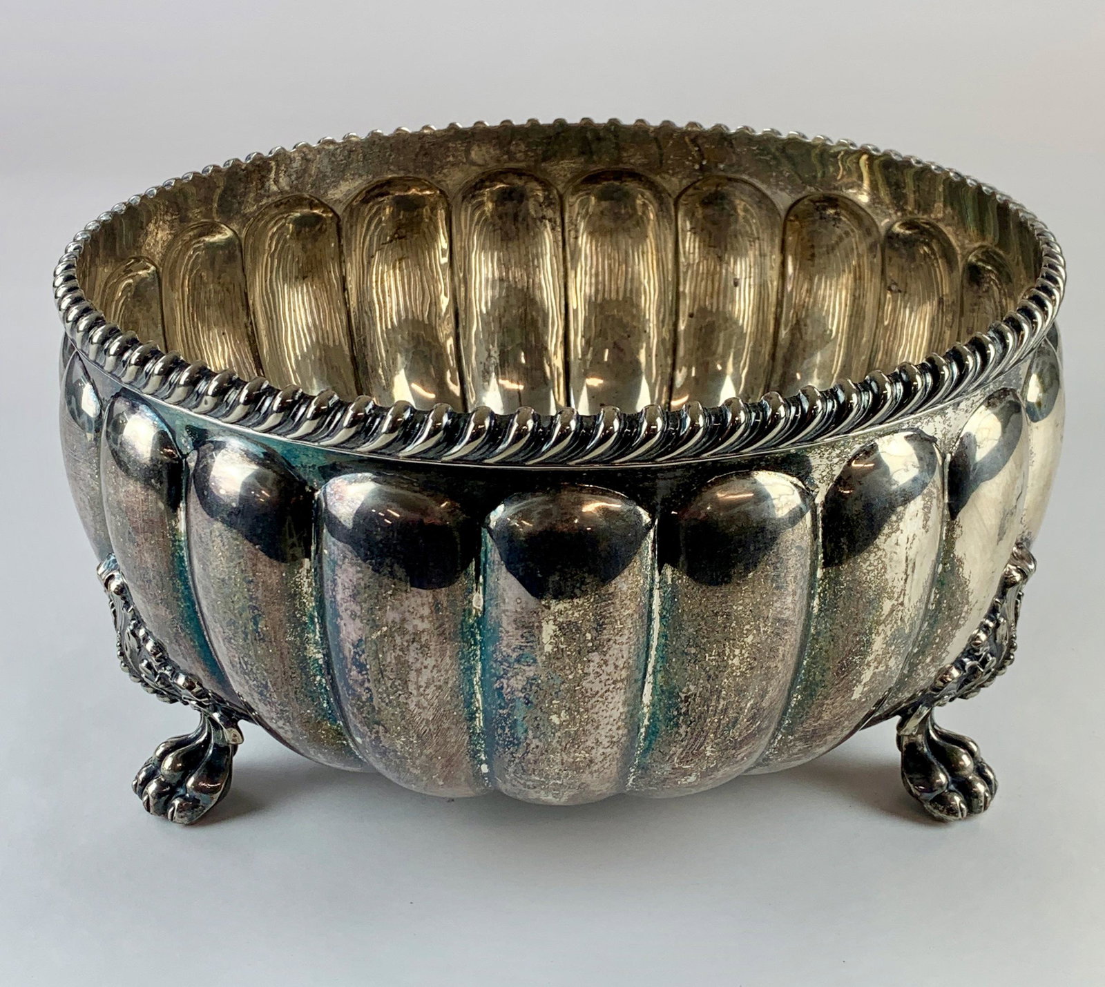 Punch Bowl and Cups by Sissons, Sheffield: W & G Sissons, Sheffield, a large punchbowl with bell mark, along with 26 silver plated cups with matching hallmark; Punchbowl ht. 7.5" x diameter 13.5". From the Estate of Harold and Miriam Prigozen,
