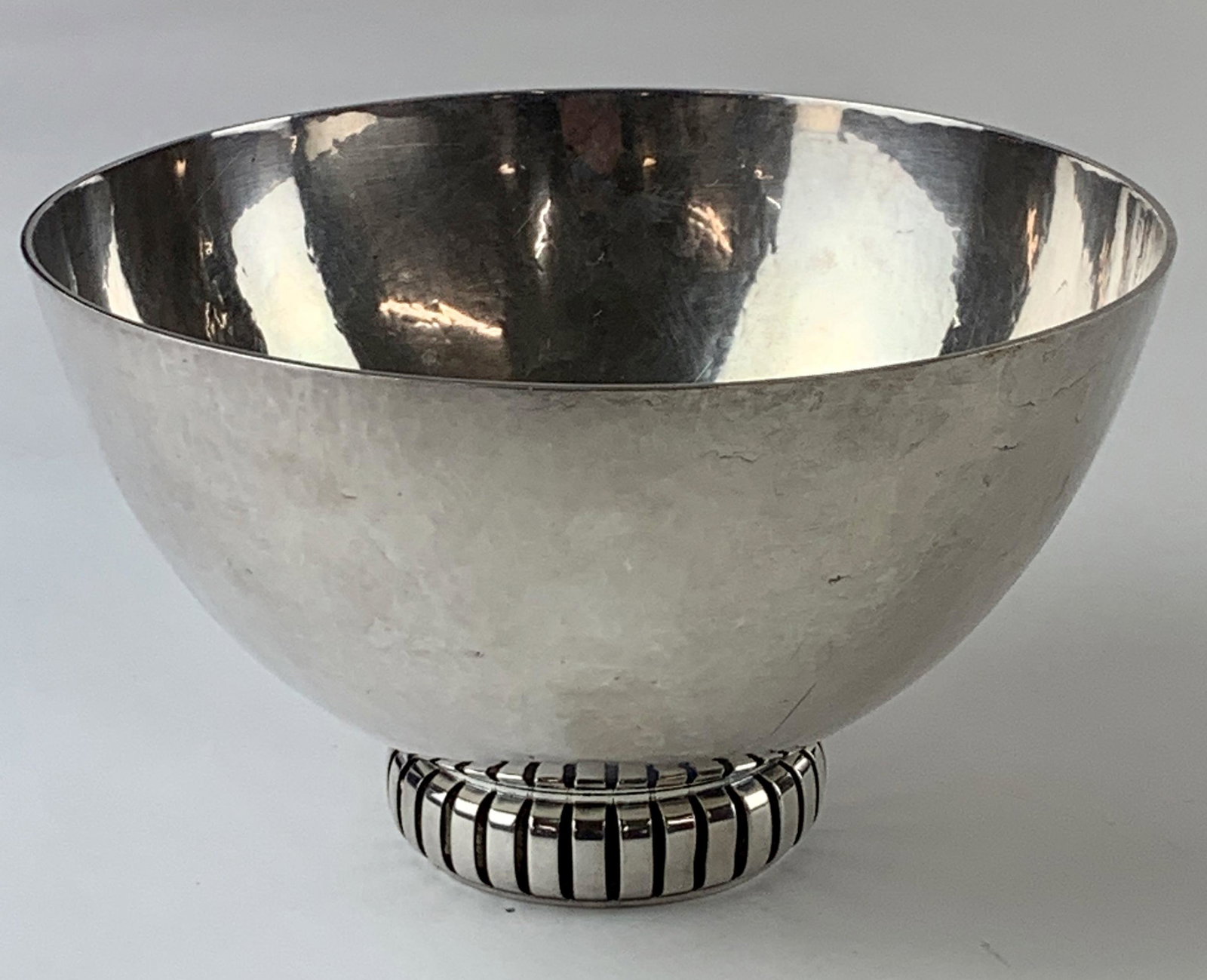 Danish Sterling Hammered Bowl by Cohr: Michael Cohr, Danish sterling footed bowl, marked to underside; ht. 4.25". 17.45 ozt. From the Estate of Harold and Miriam Prigozen, Dayton, OH.