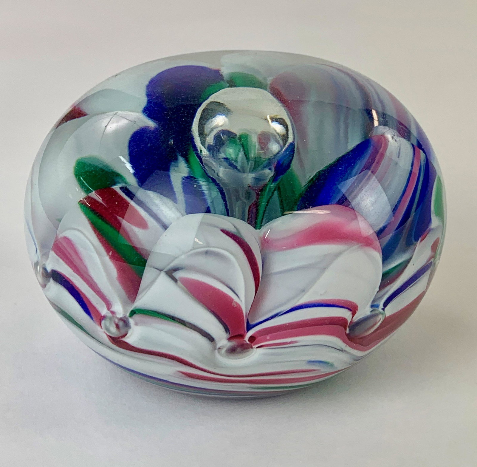 Joe St. Clair Paperweight: Floral glass paperweight with elaborate design, marked with maker name "St Clair" to underside. 3.75" diameter. From the Estate of Harold and Miriam Prigozen, Dayton, OH.