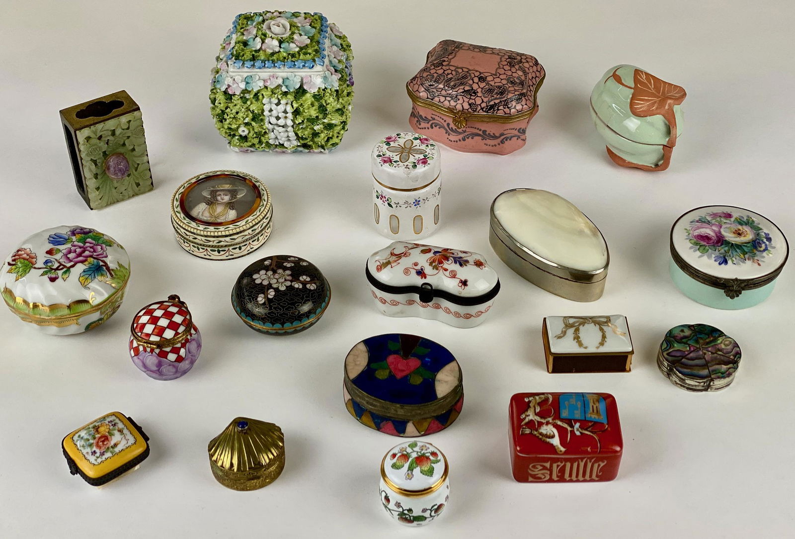 Snuff, Pill and Matchbox Collection: A fine collection of mostly early 20th and late 19th century boxes, including the following: a plated and shell Indian box, a Pietra Dura, a Chinese match box with bowenite, a cloisonne box, a Mexican