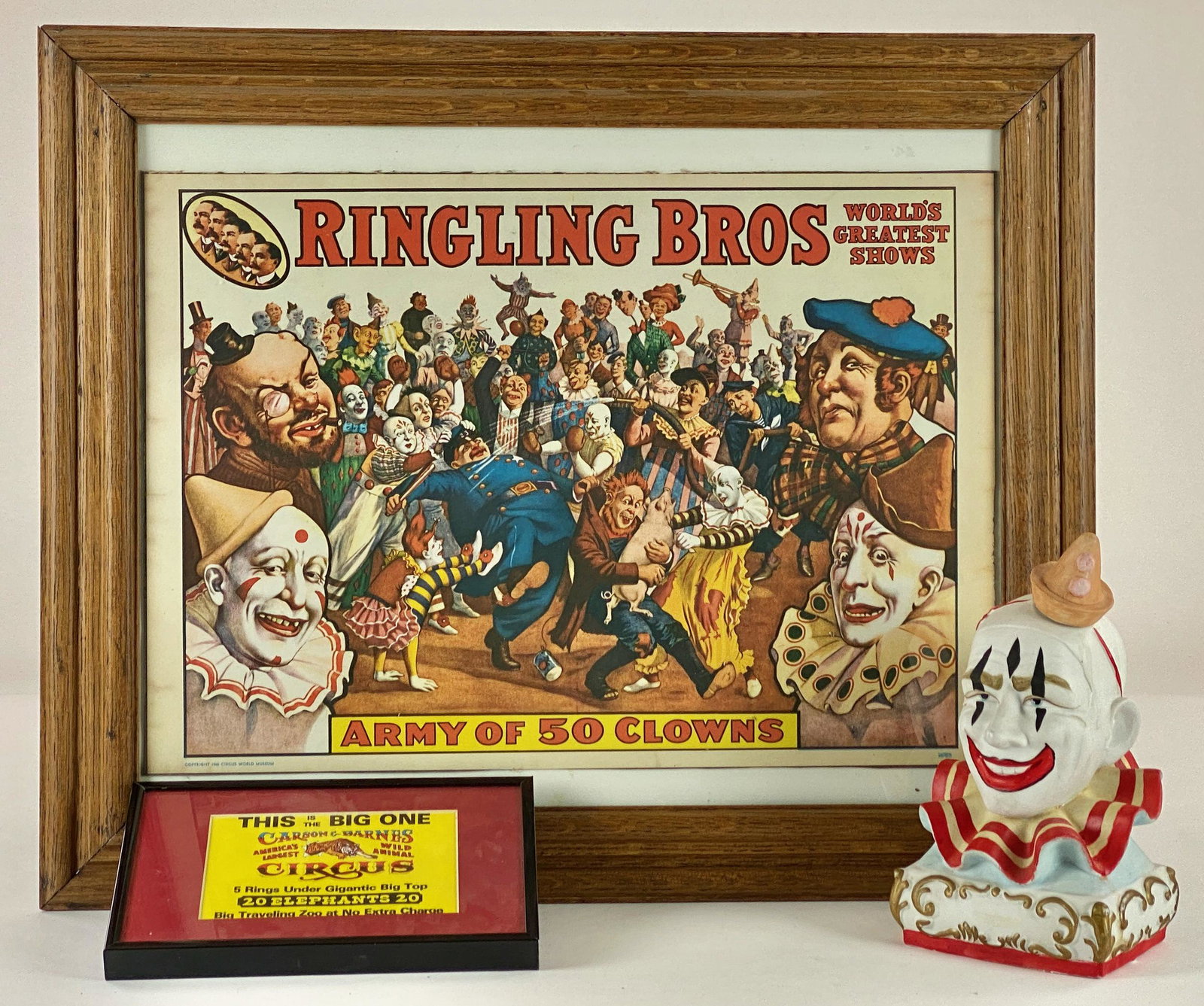 Circus Ephemera: Including a Ringling Bros. framed poster, a Carson Circus framed flyer, and finally a porcelain clown bust, by Ezra Brooks; ht. 9".