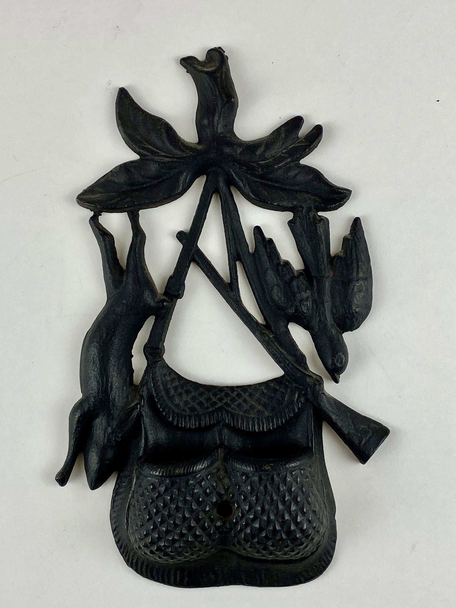 Cast Iron Wall Pockets and Boot Jack: Including a hunter themed wall pocket in cast iron, as well as cast iron monogrammed wall shelf, and finally a beetle form boot jack; tallest ht. 14".