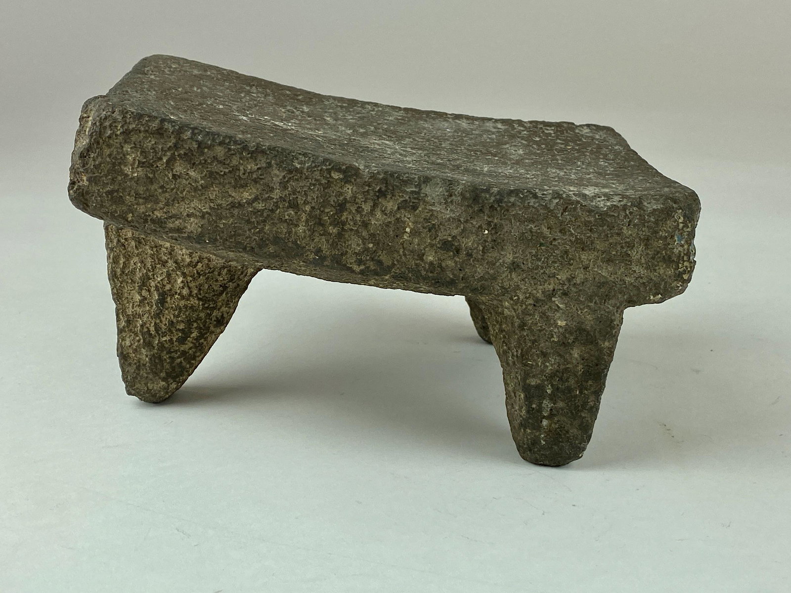 Metate Corn Grinder: A metate on three feet; ht. 4.5".