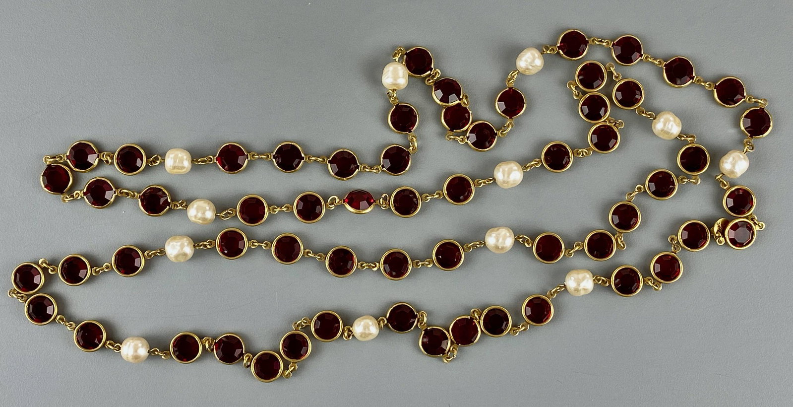 Vintage 1981 Chanel Red Glass and Pearl Necklace: With original Chanel clasp and dated 1981, containing red-colored glass stones and pearls. Total weight: 81.4 grams