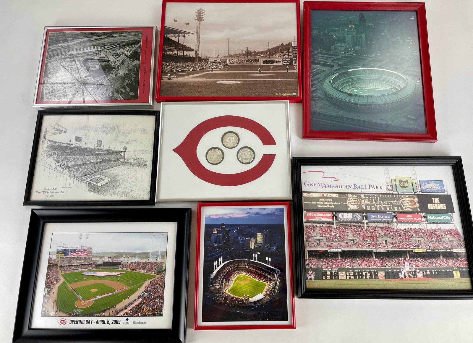 Cincinnati Reds Ballpark Images and Coins: Images or renderings of Crosley Field and Great American Ballpark, also three framed coins commemorating the 1990 pennant and World Championships. Largest 12" ht x 15" wd. (frame)