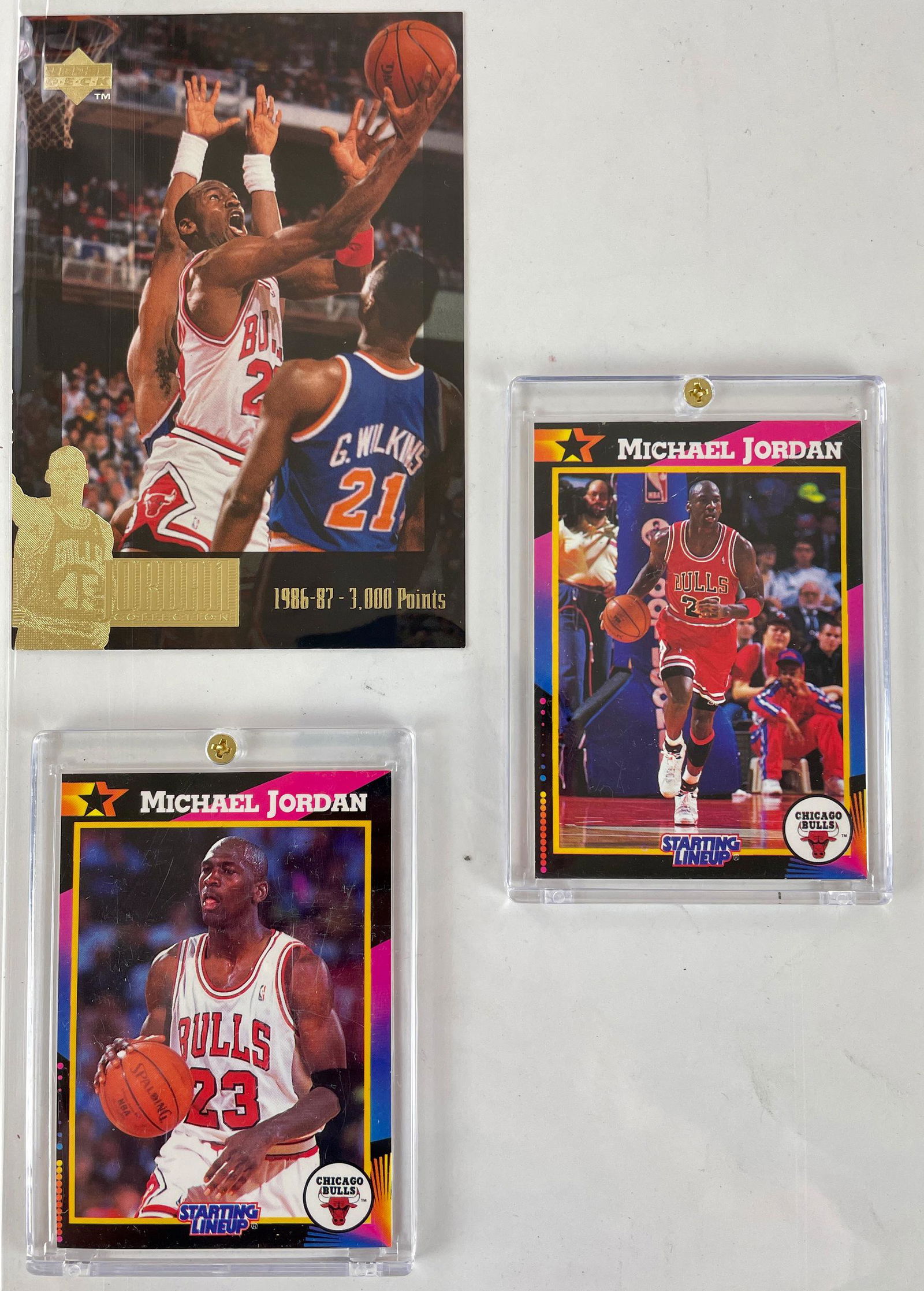 Michael Jordan Kenner Starting Lineup Cards: A nice pair from Kenner, depicting Jordan dribbling. Along with a loose Upper Deck Jordan card.