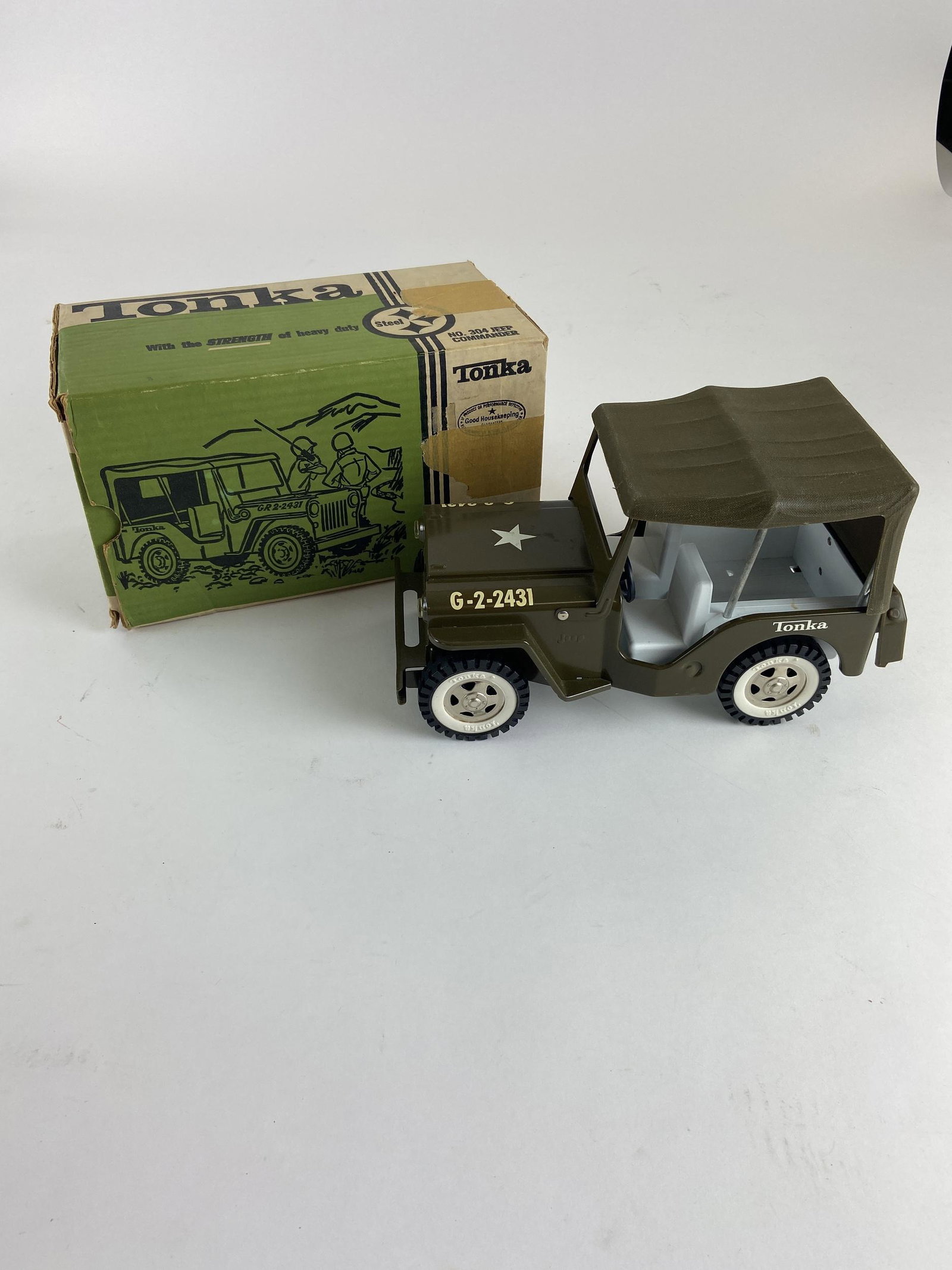 Tonka Jeep Commander in Original Box: A Tonka "No. 304 Jeep Commander" in very fine condition, also with original box in good condition with the exception of some tape. Box lg. 11.25".