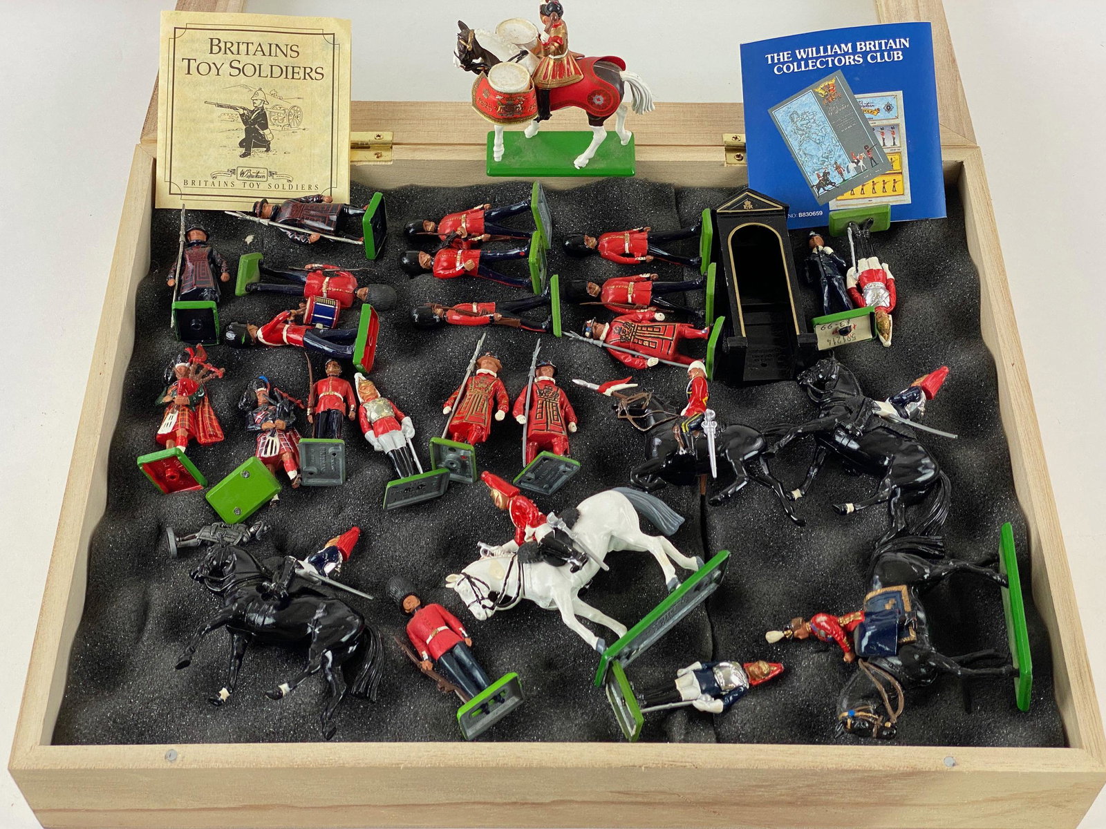 Collection of English Toy Soldiers and Vehicles: A large collection of painted tin soldiers, an ambulance, and war planes. 15" wd. x 12" lg. x 4" ht.