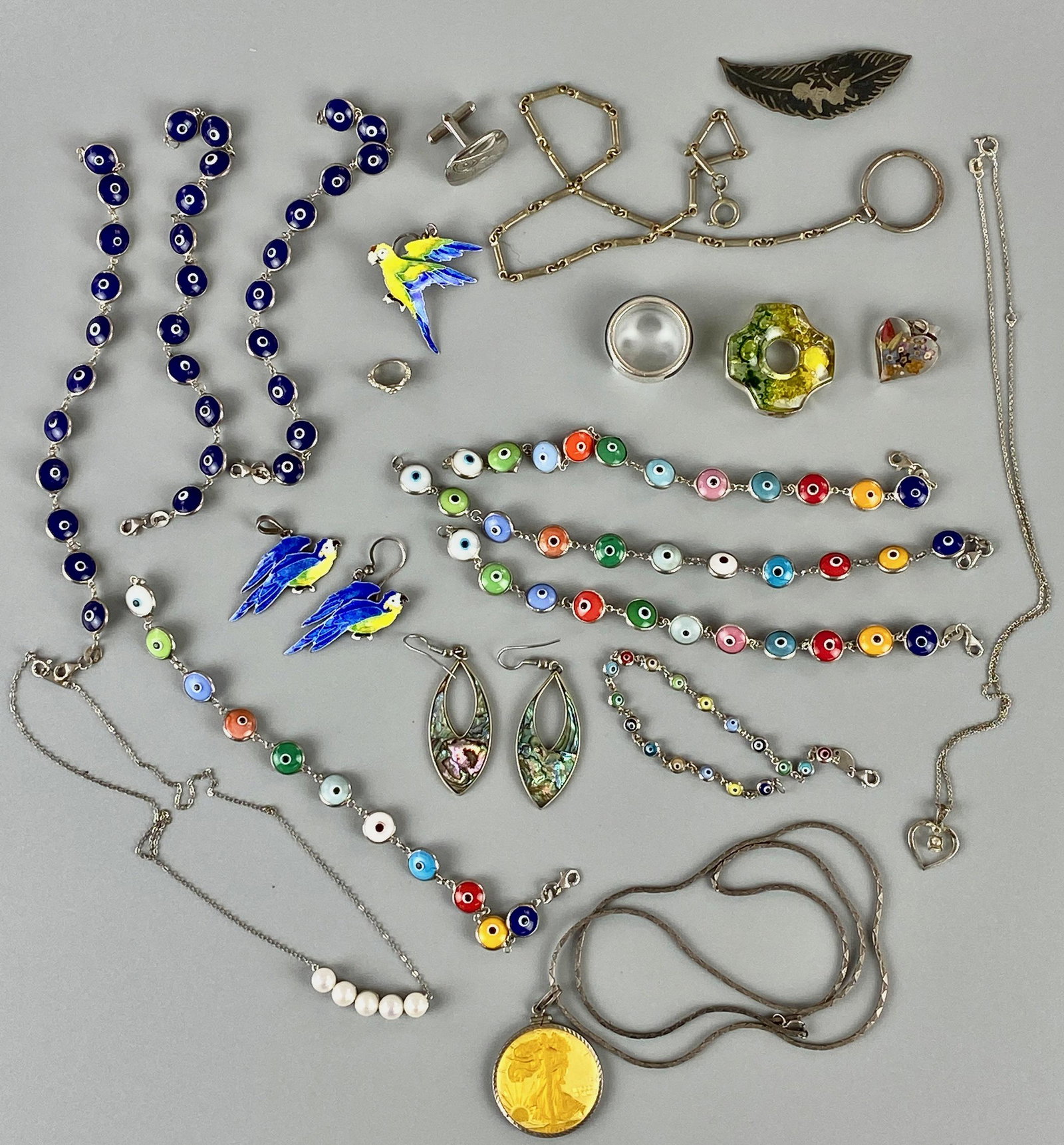 Assortment of Sterling Silver Jewelry: A variety of Sterling silver jewelry. Total weight: 3.33 troy ounces A selection from the estate of the late Charles Cotterill, a