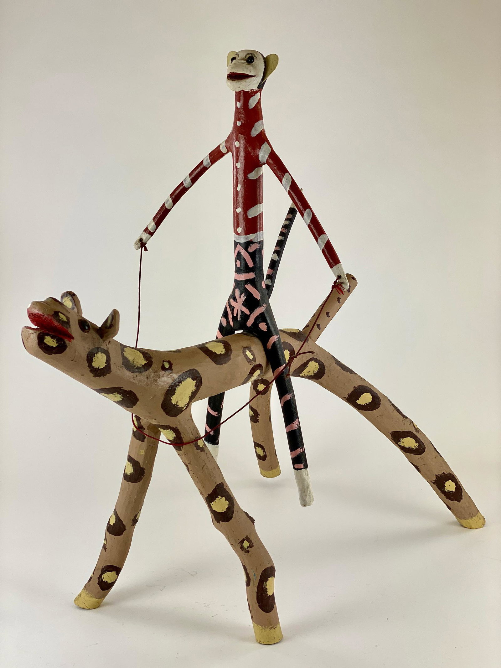 Edd Lambdin, Monkey Riding a Spotted Creature: A monumental folk art carving by the well-known Edd Lambdin, signed to the underside. All in original paint with great color. Height: 31", Length from head to tail: 27.5" From the lifetime collection