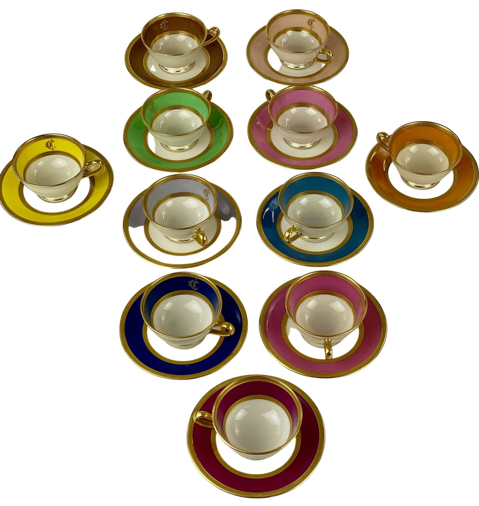 Set of Multicolored Lenox Teacups & Saucers: A neat set of 11 cups and saucers, each with a different ground, and patterned gilt rims and interior bands. Each initialed in gilt and marked to underside. Ht. of each when presented together 2", dia