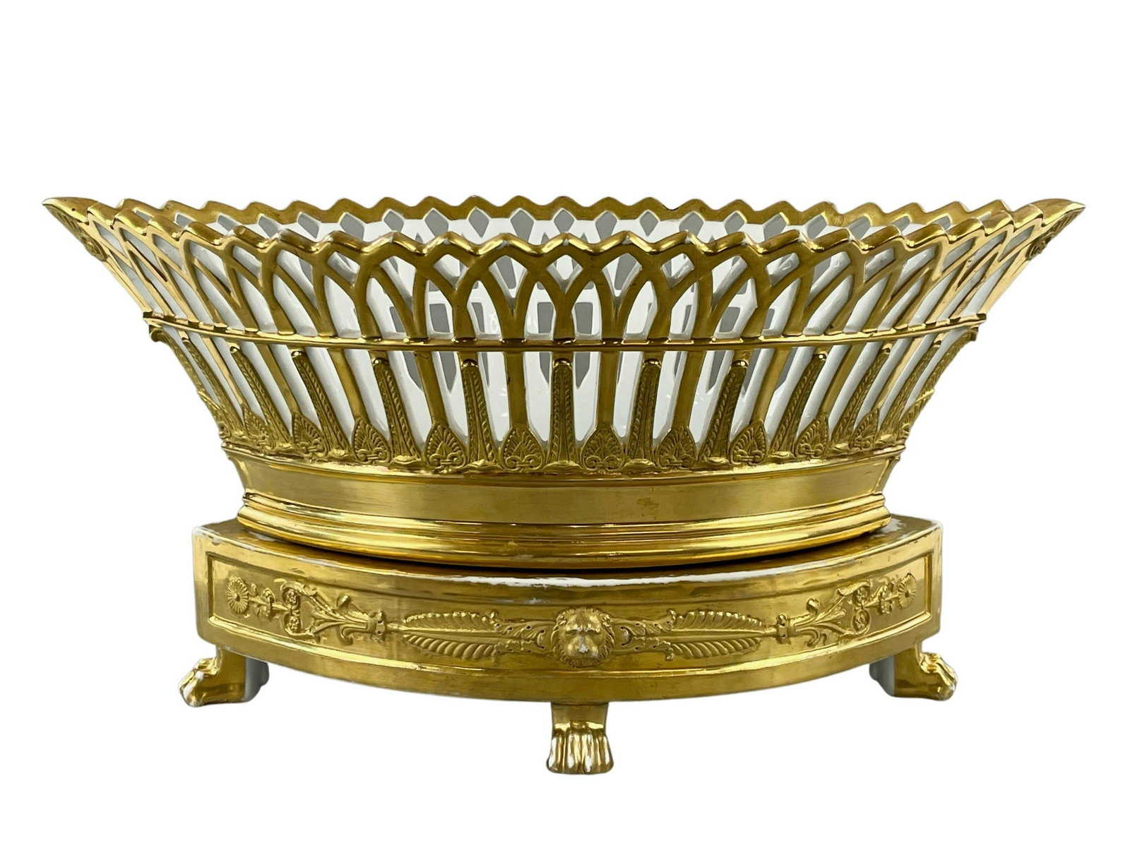 Paris Porcelain Rihouet Pierced and Gilt Centerpiece: Signed Rihouet in red to underside. A porcelain gilt decorated base and centerpiece above, with neoclassical relief and pierced top. Substantial in size, with paw feet to base. Ht. 8.5", lg. 16".