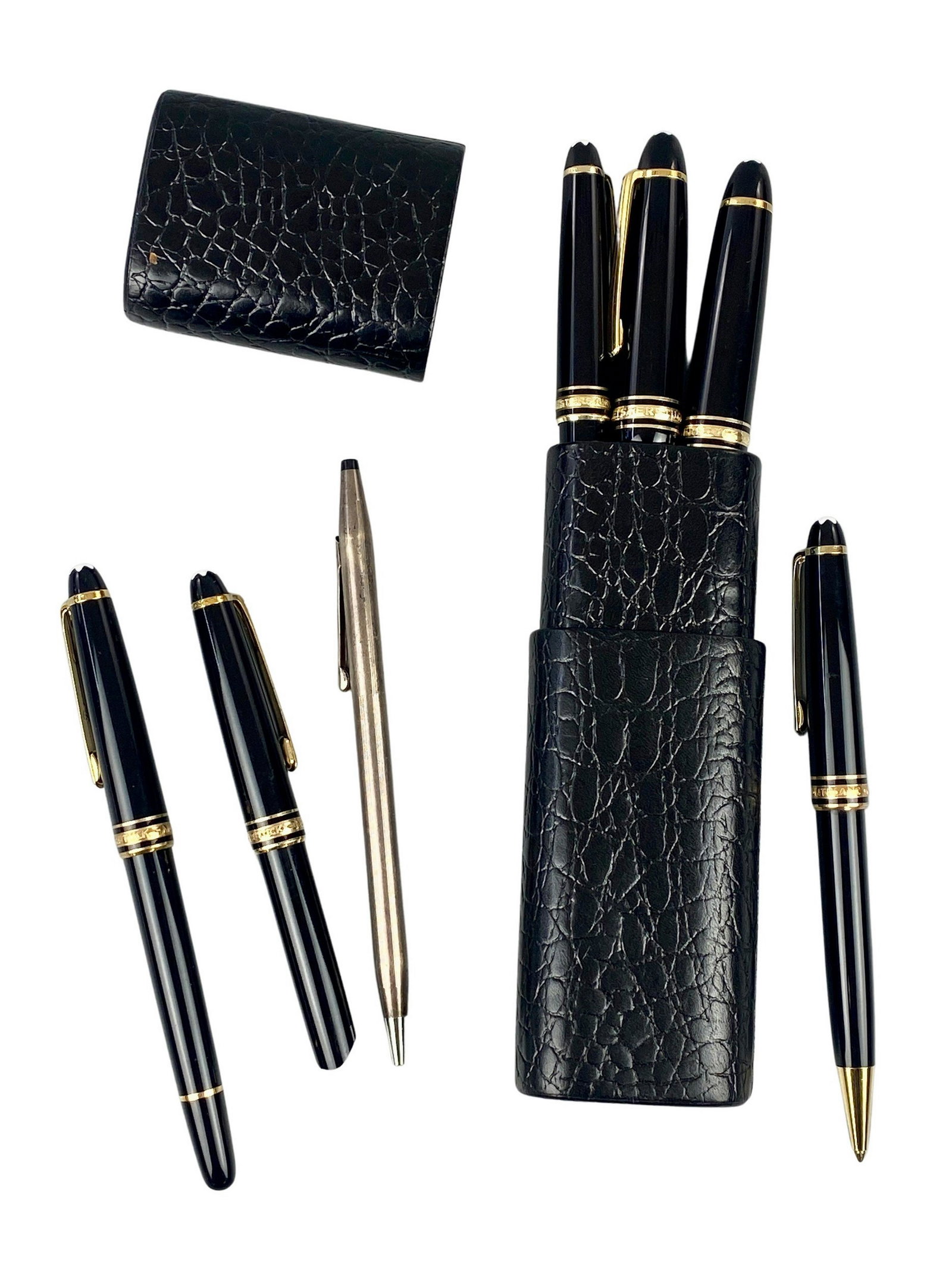 Six Montblanc Pens and Case: A group of six vintage Montblanc pens, including two with larger bodies, each in black and gilt and each marked, along with a case which holds three Montblancs. Also a Gross pen included.
