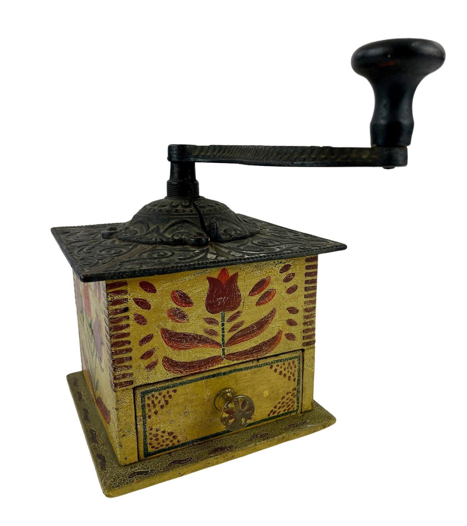 Pennsylvania Wooden Painted Coffee Grinder: A nice coffee grinder, decorated in floral design throughout, with mustard, green and red, nice alligatoring to the surface and, in addition, a small textile with theorem painting to the interior draw
