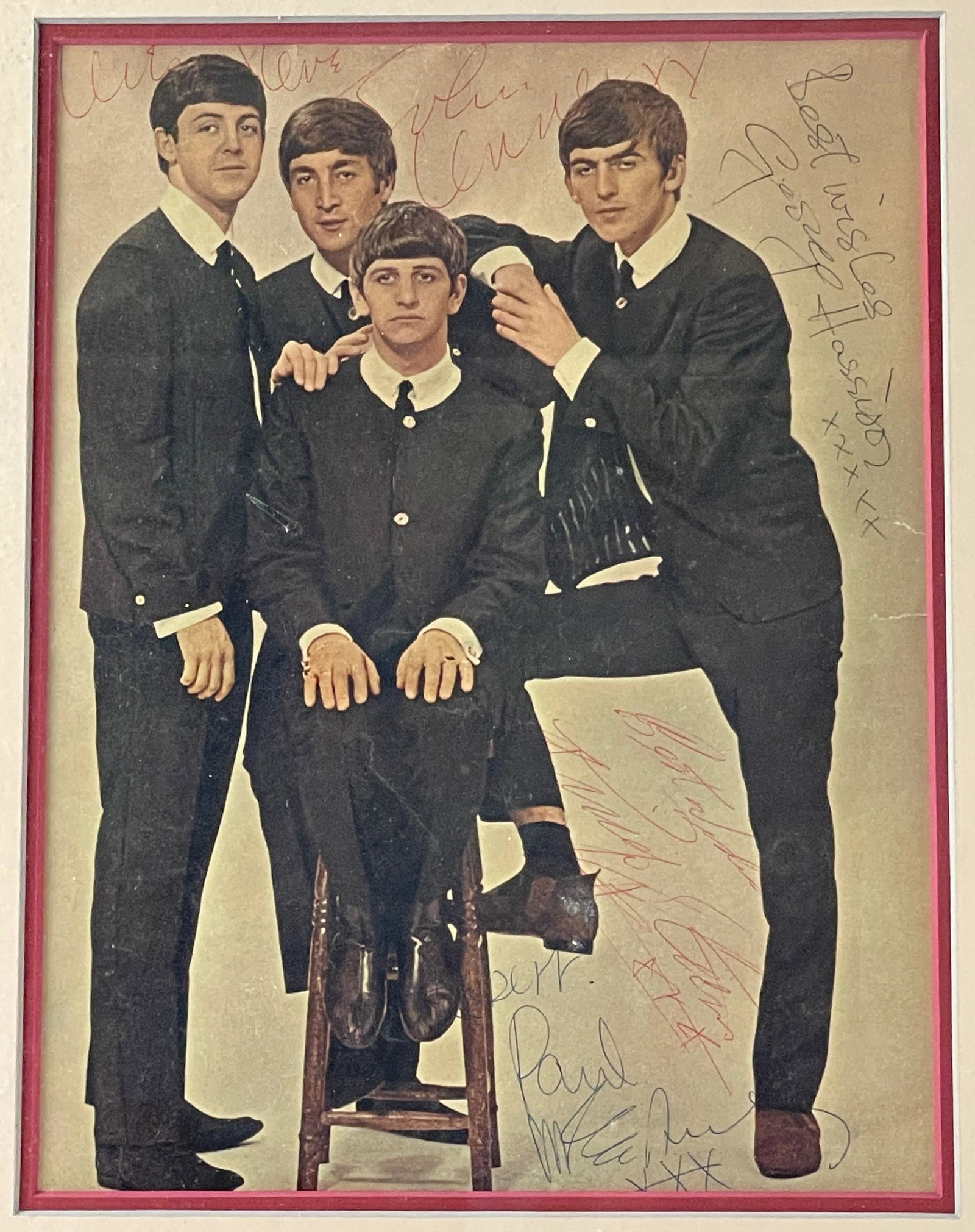Photograph Signed by All of the Beatles, Early 60s: An offset lithograph after a photograph, likely pulled from "The Beatles Fabulous" in UK Magazine, depicting the Beatles in the early 60s, with Ringo on a stool and the other 3 members standing around