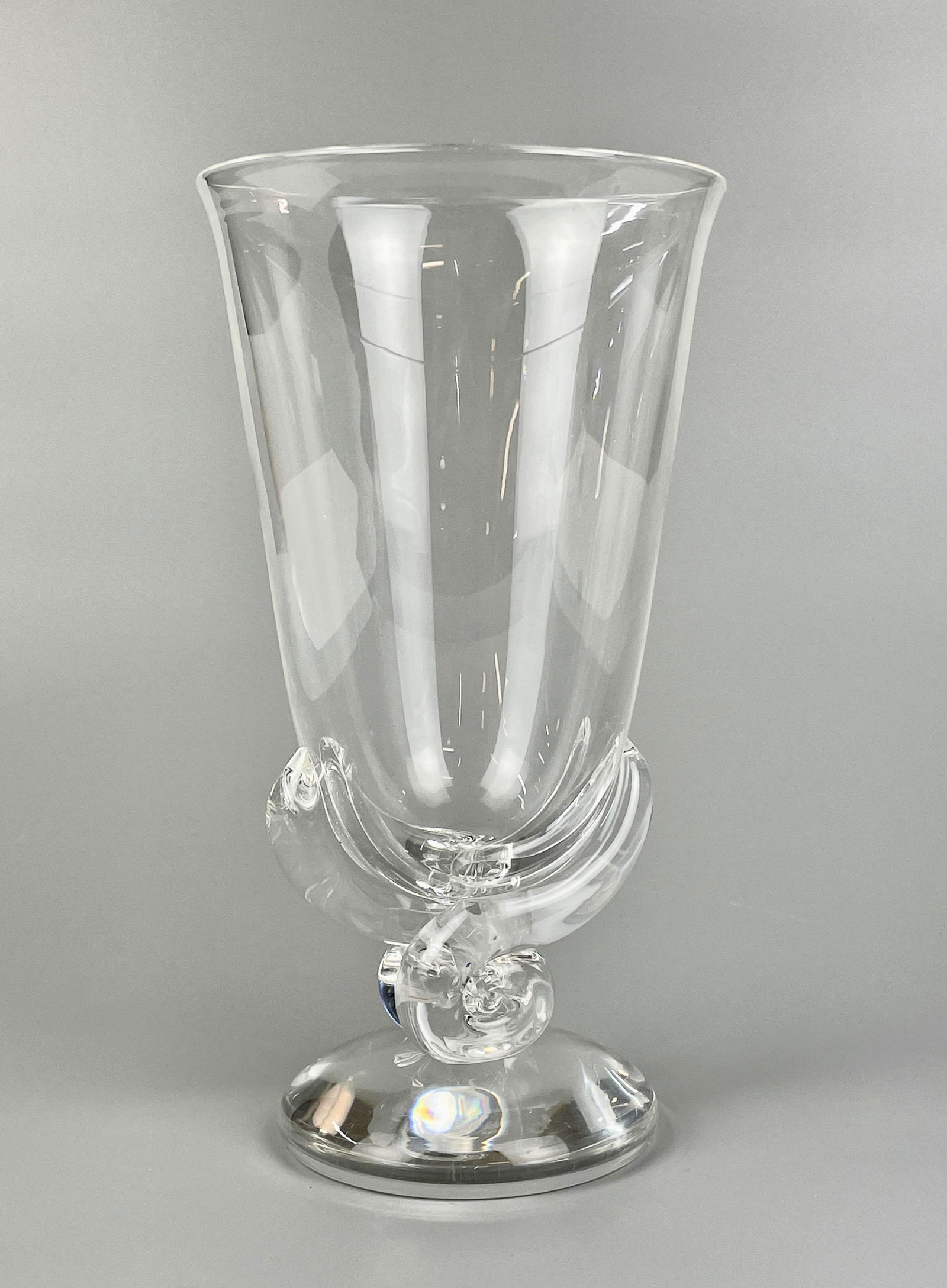 Steuben Vase: A Steuben glass vase with shell form base, signed to underside. Ht. 8.5".