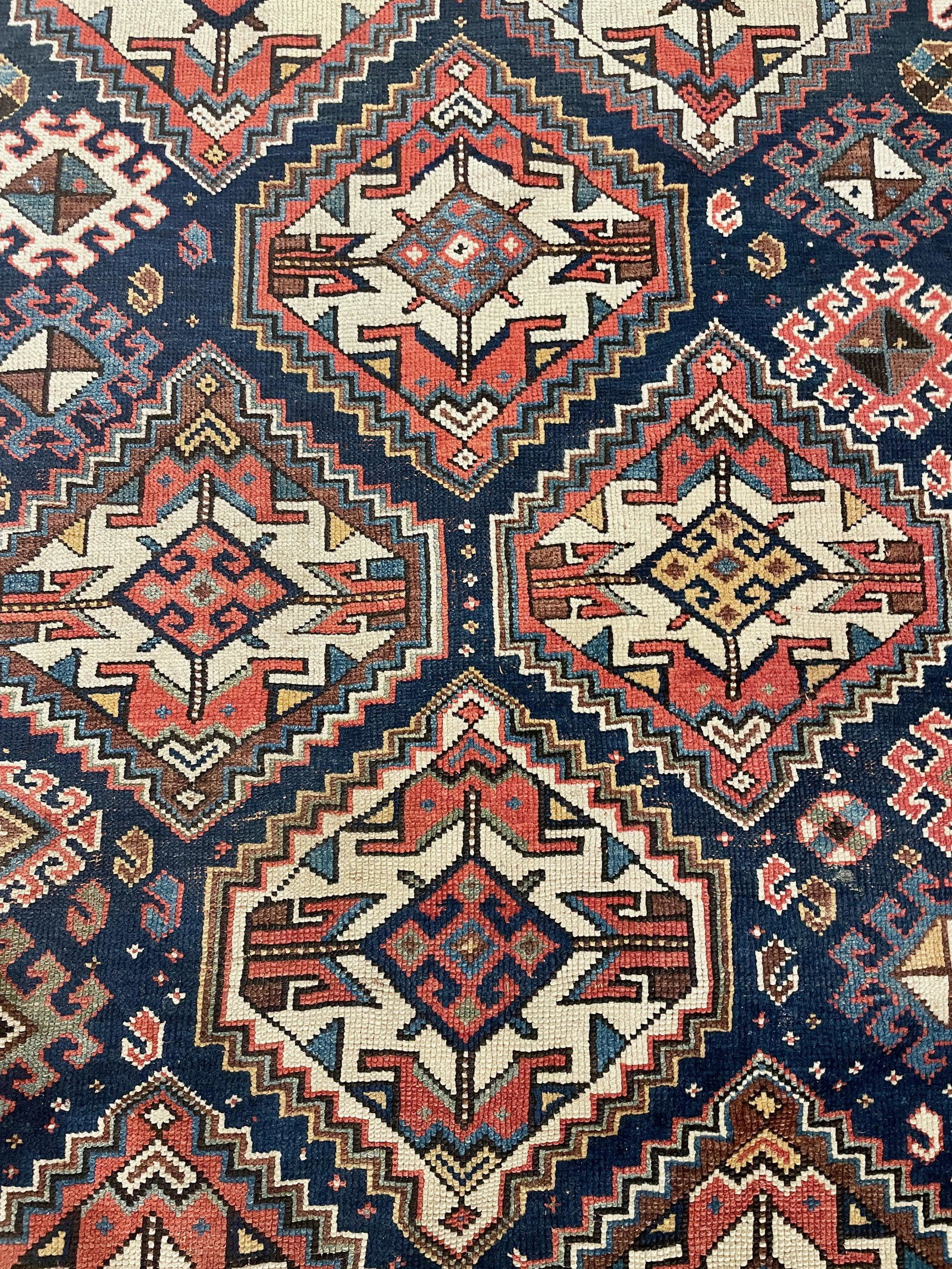 Caucasian Area Rug: Early 20th century, a geometric designed Caucasian area rug. 113" x 56".