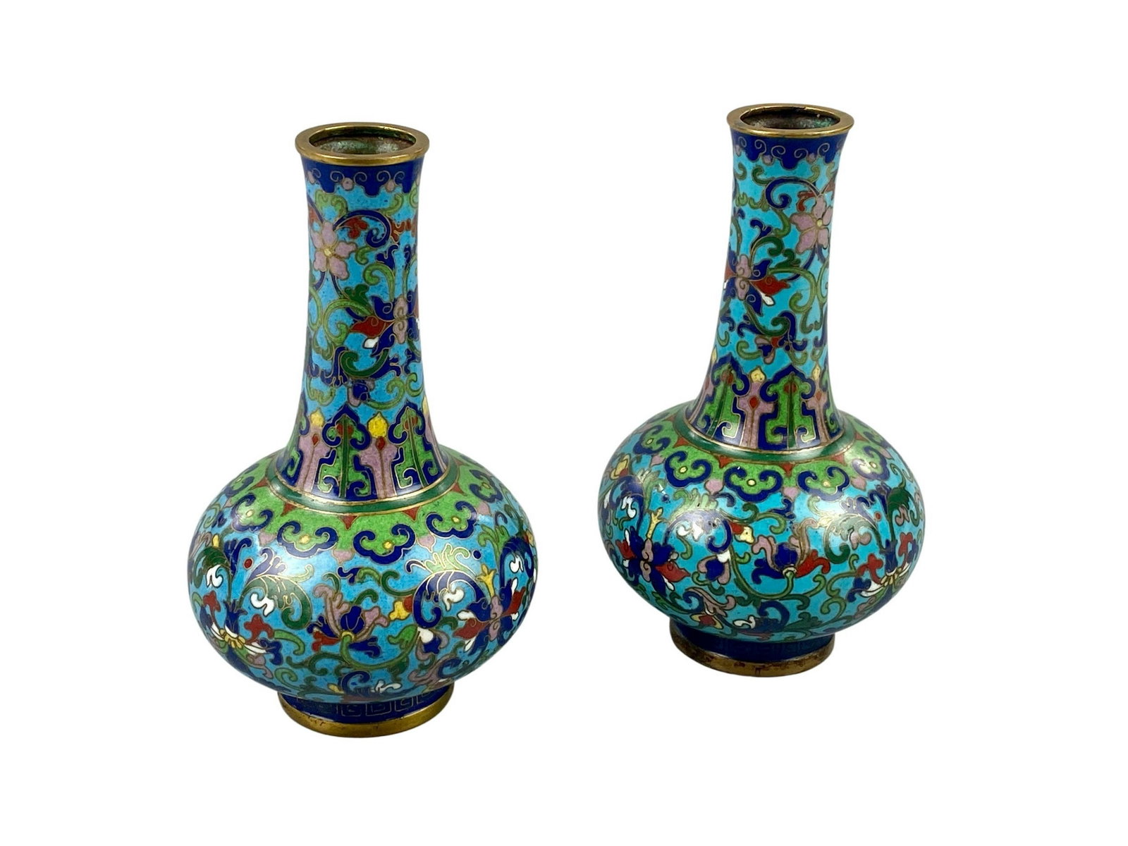Pair of Chinese Cloisonne Vases: A pair of Chinese cloisonne vases, each with ormolu rims and fet, unmarked, in geometric and foliate designs. Ht. of each 5.75".