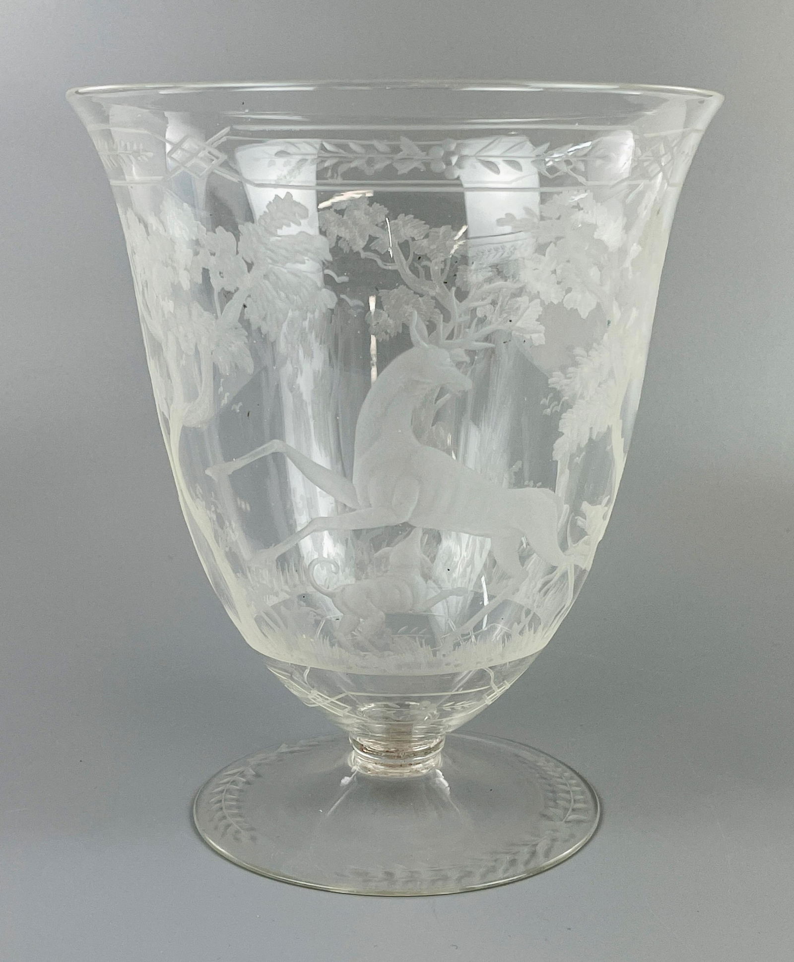 German Copper Wheel Engraved Centerpiece Bowl: Wildlife hunting scene of hounds stalking a buck. Engraved in the round. 8" ht., 6.75" diameter at widest point From the lifelong collection of Dennis Wils