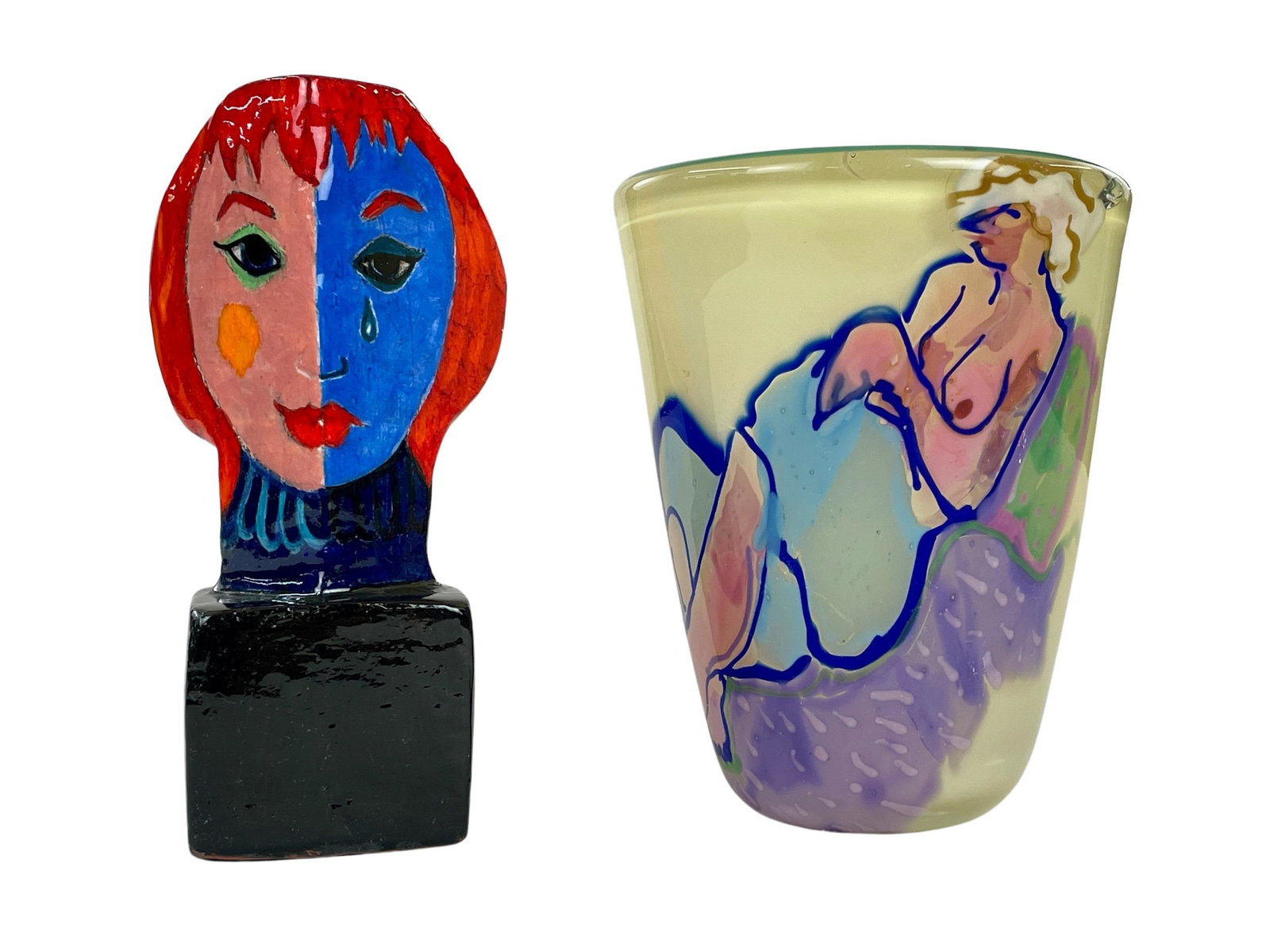 Pair of Female Form Glass and Ceramic Works: An art glass vase from Katherine Banston dated 1983 of a reclined partial nude, along with a Cubist bust form female head, unsigned. Vase measures 7" ht. x 5.5" diameter and is substantial in construc