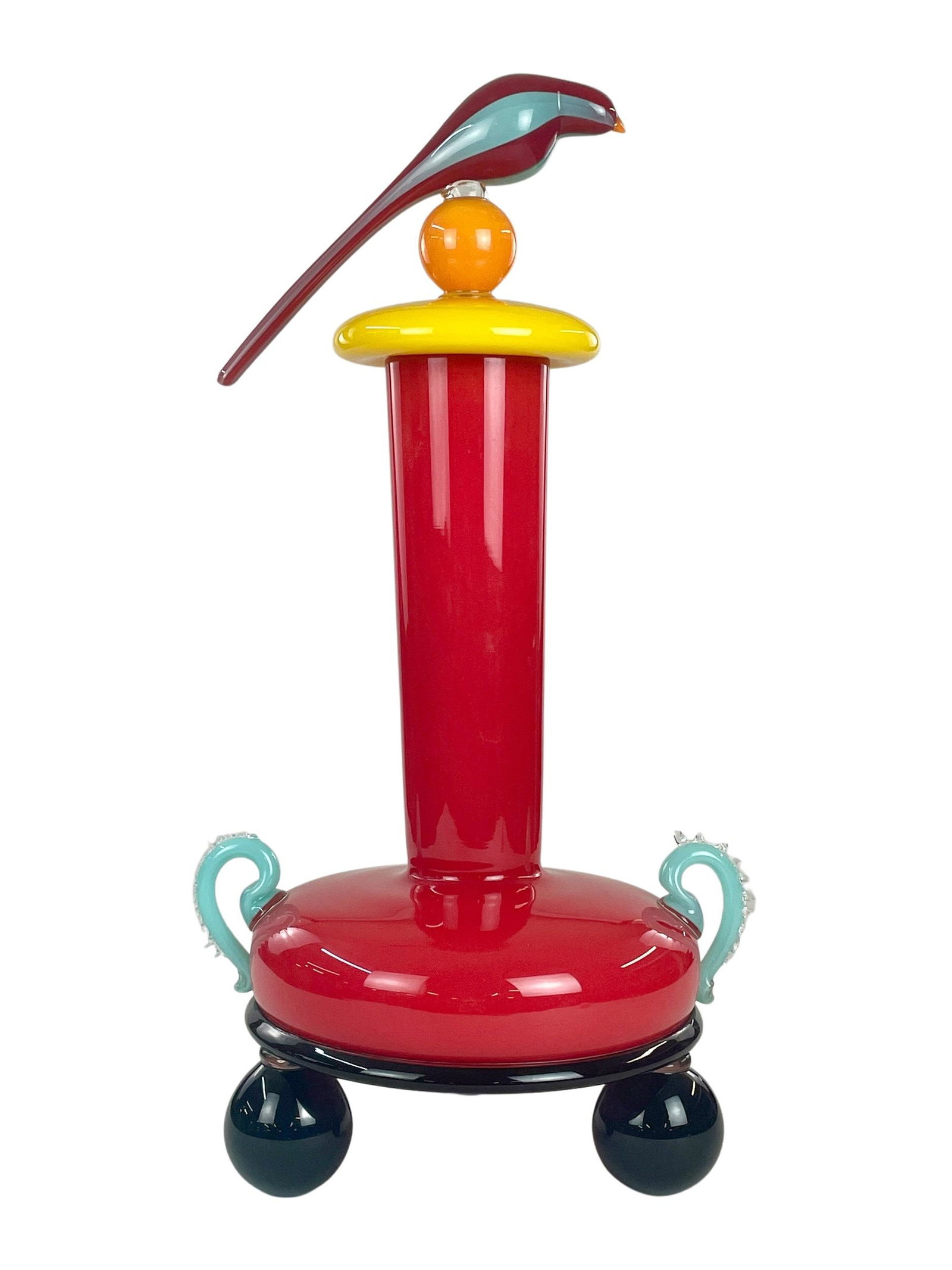David Levi (American, b. 1959) Bird Vase: Large scale David Levi (American, b. 1959) Murano style art glass composition, with three footed design and signature perched bird on removable lid. Signed and dated by the artist, 1998, on bottom. To