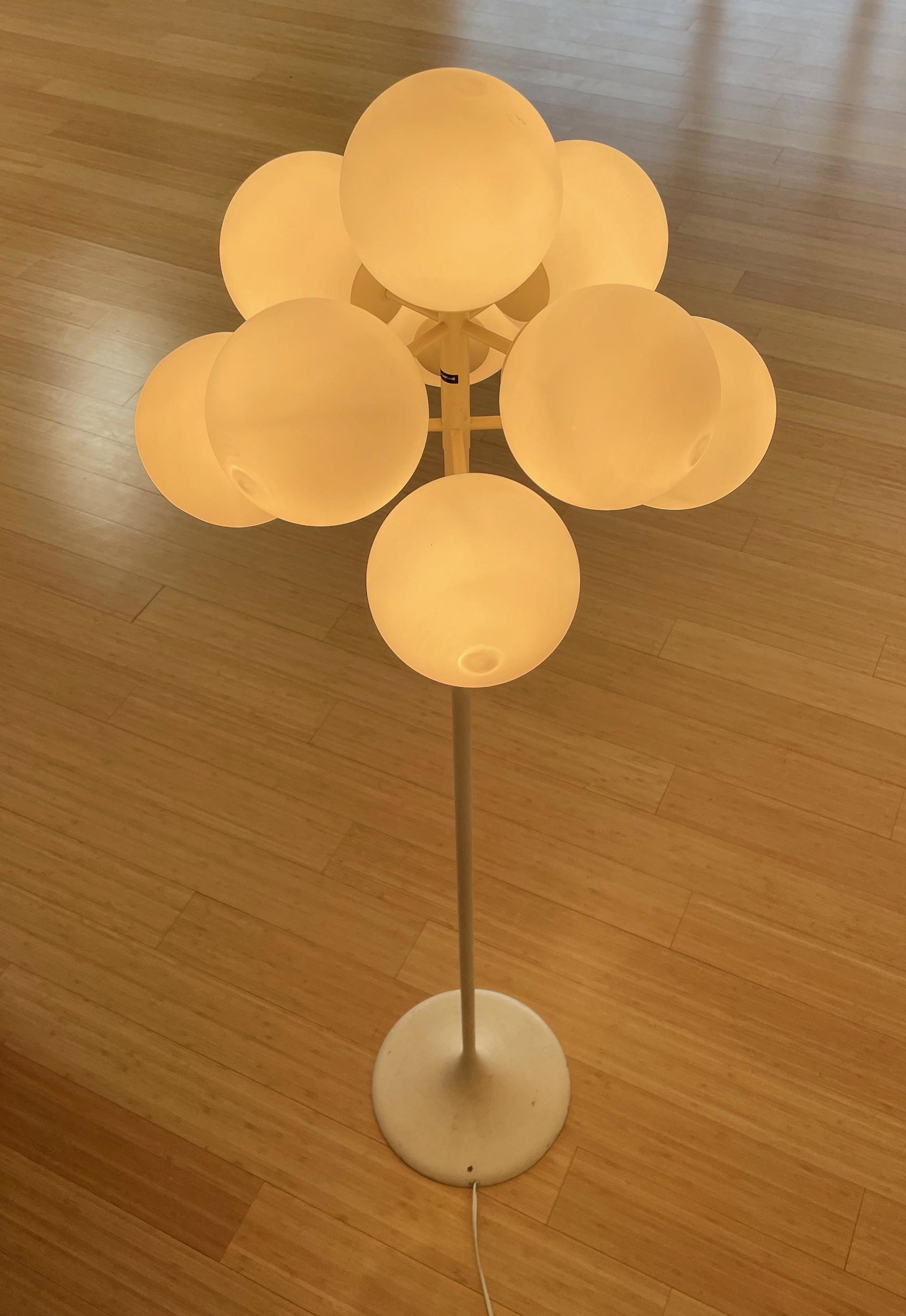 Mid-Century 9 Globe Cluster Floor Lamp: Mid 20th Century, a standing floor lamp with 9 globes which form a cluster. Total ht. 62". Property from the Estate of an Indi