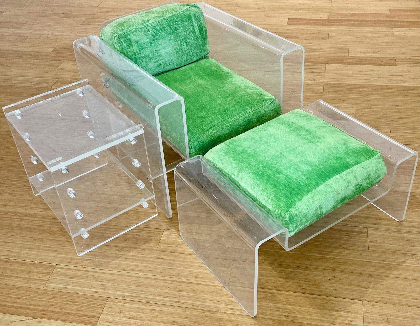 Spiros Zakas Lucite Chair, Ottoman, Side Table: A lucite armchair, ottoman, and a side table all in lucite, with bright green upholstery. Property from the Estate of an Indian Hill,
