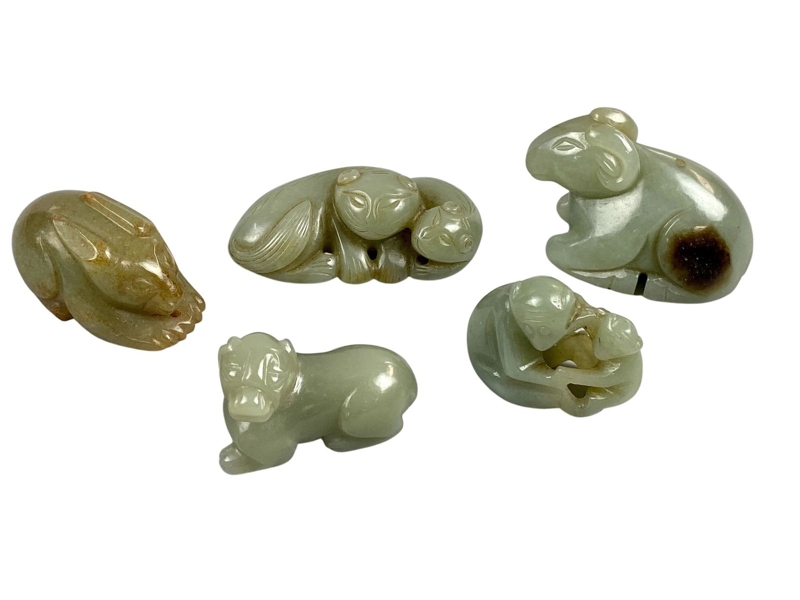 Chinese Celadon Jade Animal Carvings: Including five small 20th century jade carvings of animals. Longest length: 2.5"