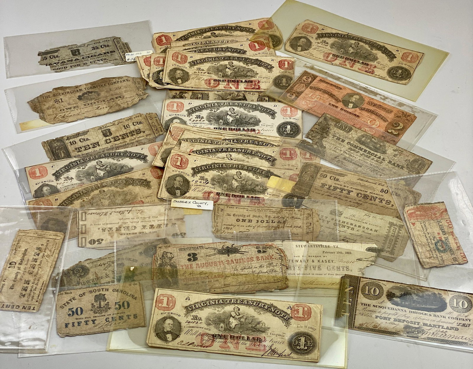 Large Collection of Confederate & Southern Currency: A large collection of mostly confederate currency, primarily centered around Richmond or Virginia, mostly Confederate, in numerous denominations and printing. Majority labeled with book resource notes