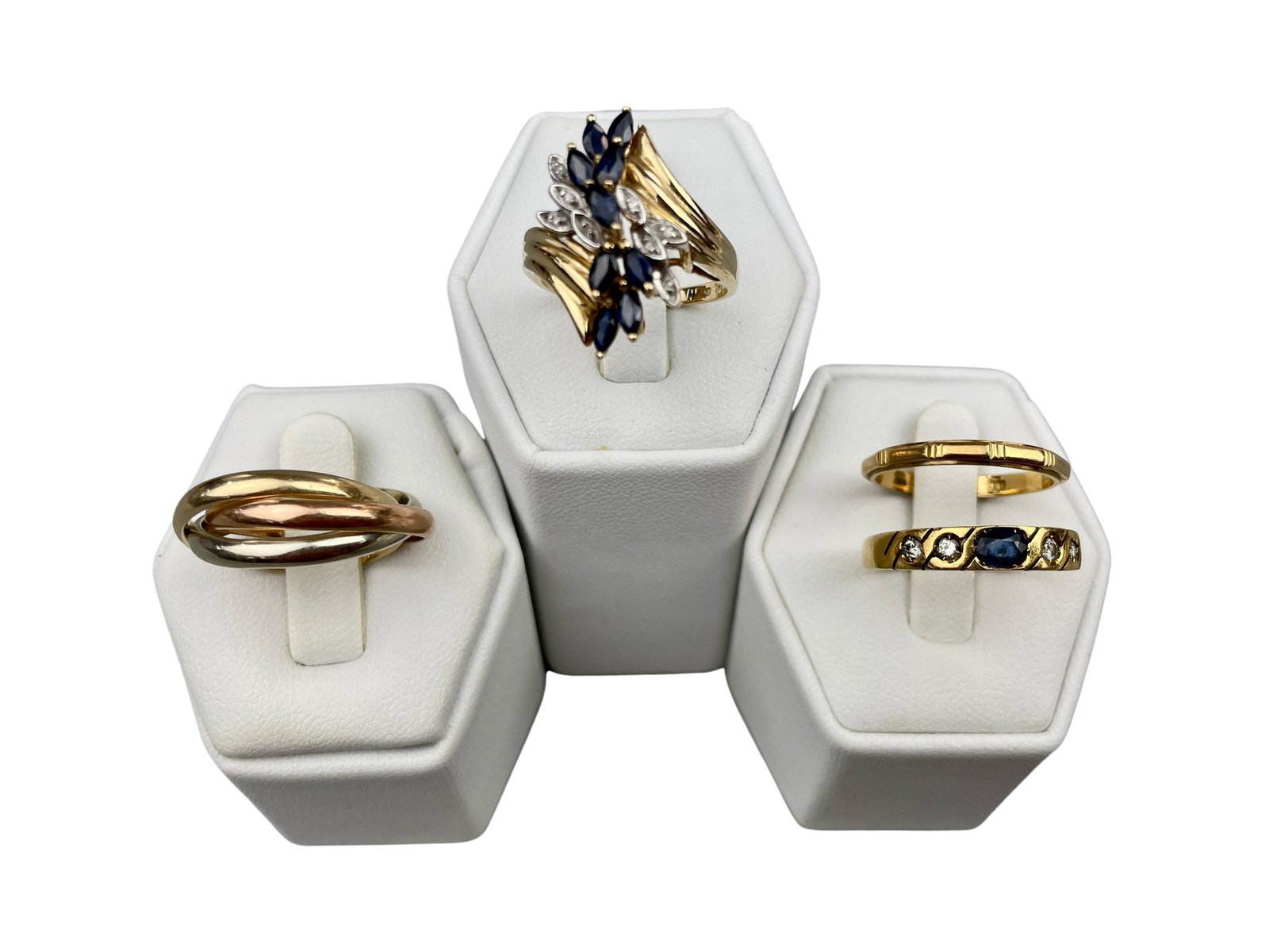 Fine Collection of 18k and 14k Rings by Various Makers: A group of four rings, including: an 18k ring with diamond and stones in a cluster, marked to interior and copyright marked with an indiscernable makers hallmark, an 18k gold (marked 750) ring with fo
