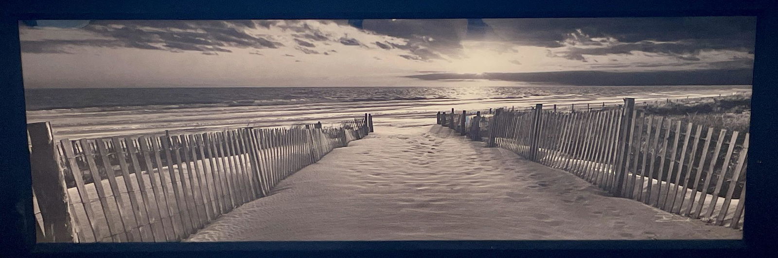Peter Lik (Australian, b. 1959) Photograph: Undated, signed lower right, #220/950 lower right, depicting a beach and seascape, in a wood frame under plexiglass, having a linen liner; with artist certificate of authenticity on rear. 19" ht. x 58