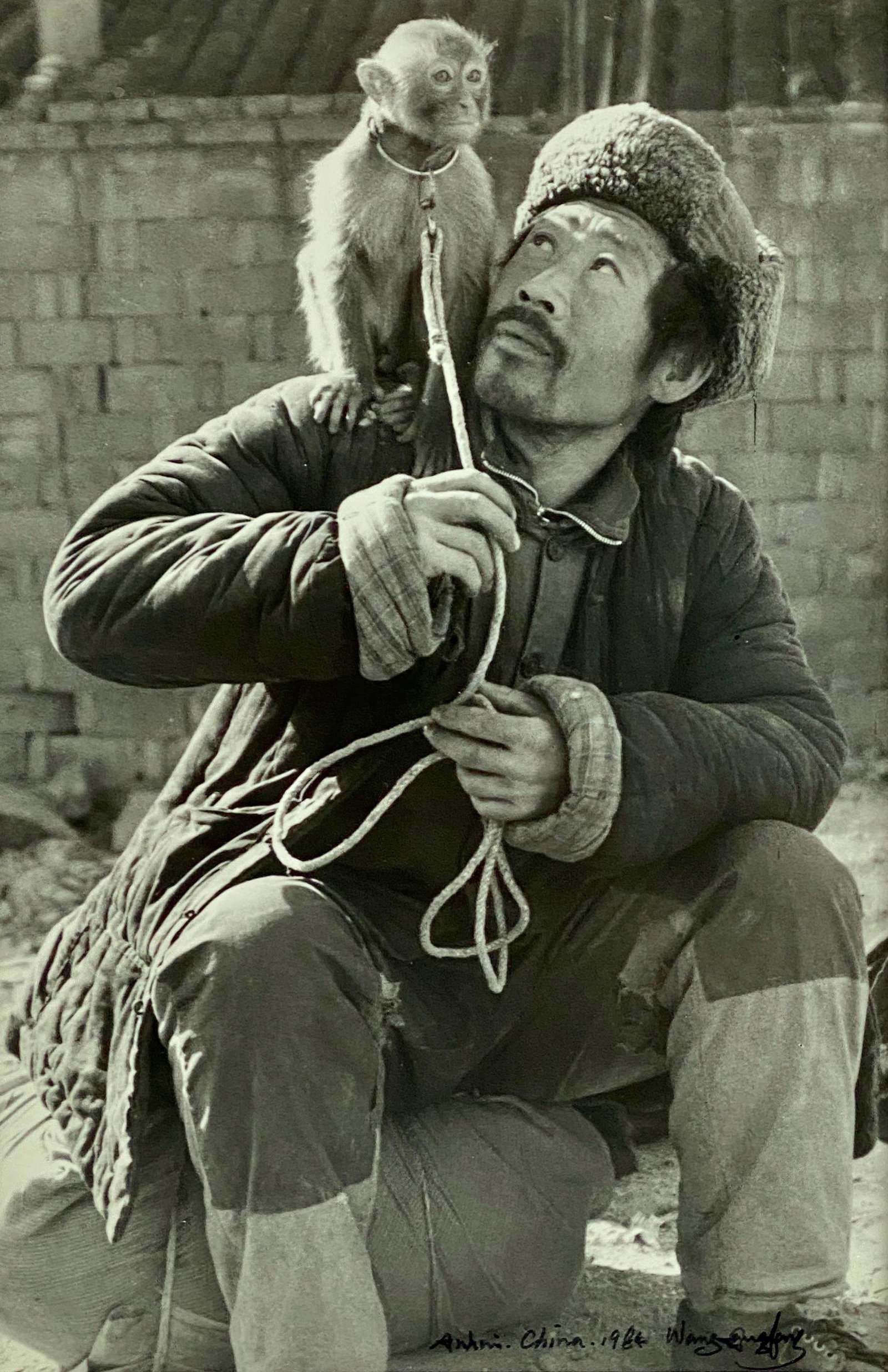 Group of Gangfeng Wang Chinese Photography: Three black and white framed photographs taken by Gangfeng Wang, from the early 1980's. Each is hand signed and inscribed and dated to the lower portion. Wang is regarded as the first freelance photog