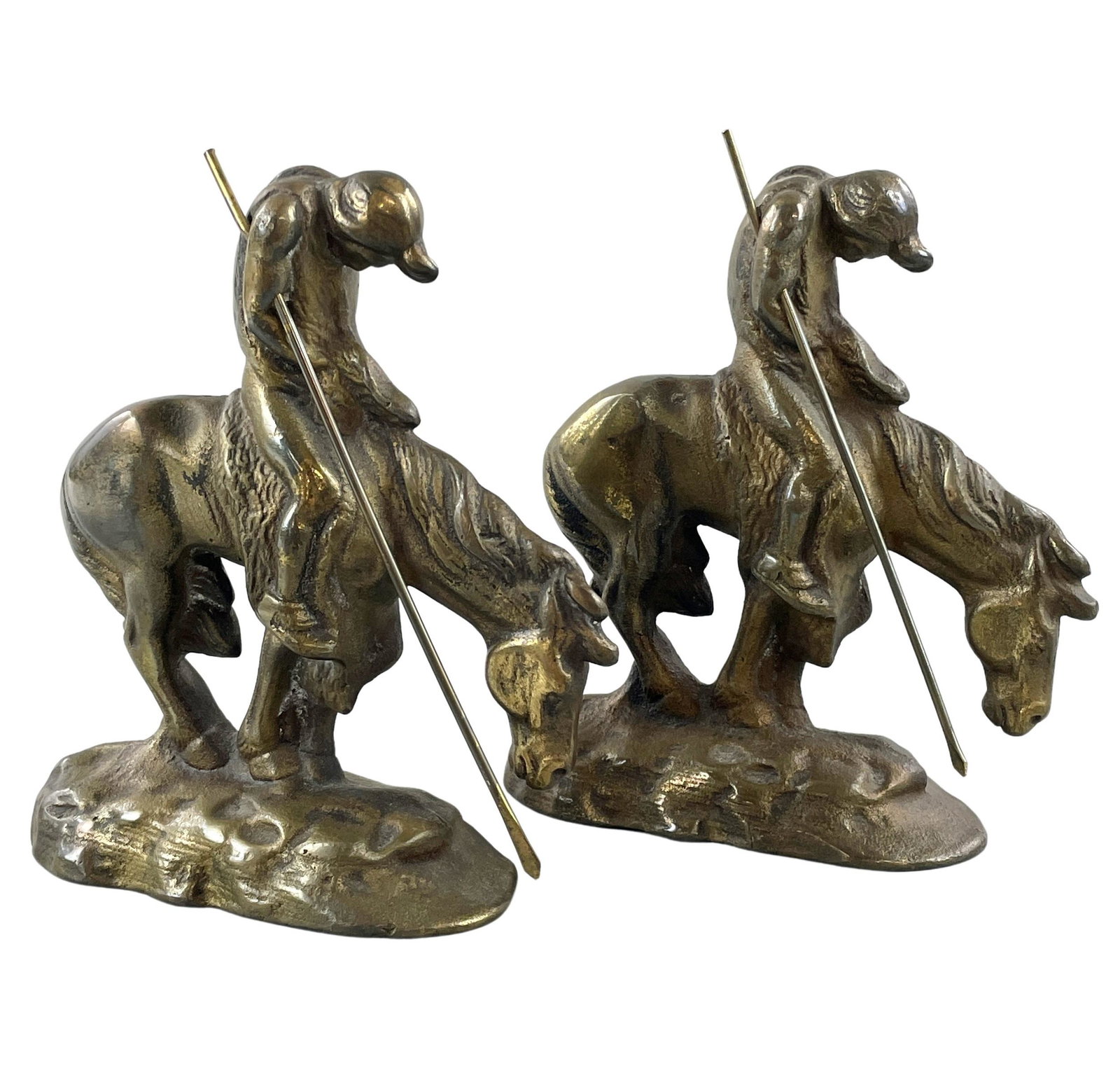 Pair of Bronze "Wicked Pony" Bookends After Remington: Early 20th century, a pair of bronze bookends after the model "Wicked Pony" by Frederic Remington. Each with separate spear. Ht. of each 6".