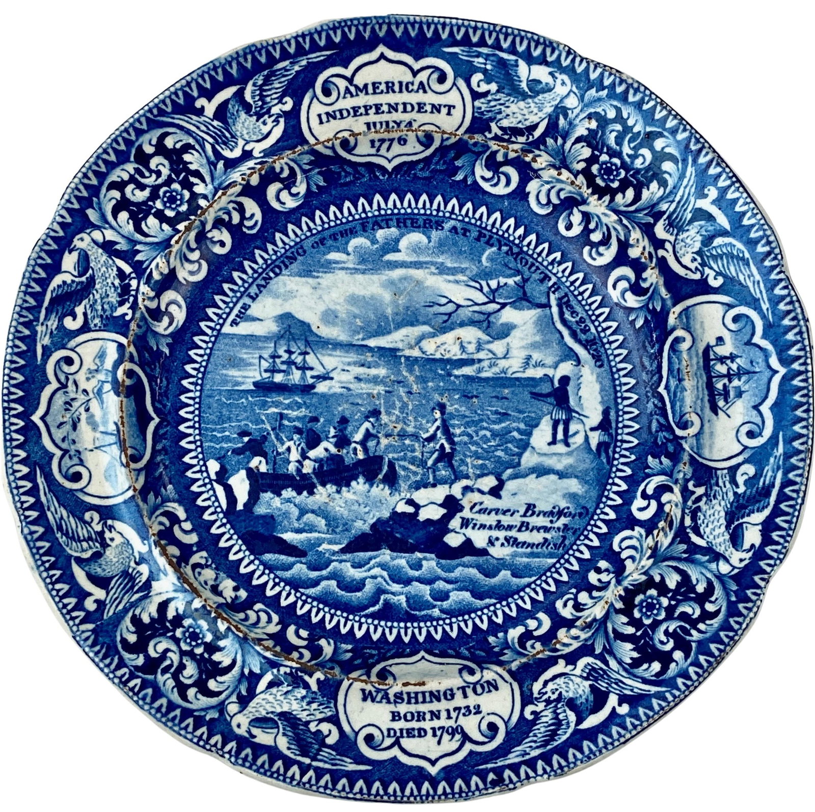 Enoch Wood and Sons Blue Staffordshire Plate: With Levy Collection sticker on base. A plate depicting America's Independence, July 4, 1776. Life dates of Washington included on lower portion. Scene in center depicts the landing at Plymouth Rock. 