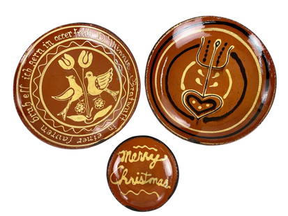 Group of Turtle Creek Slipware Pottery Pieces: All executed in 1994, two pieces by Chris Woods with interior heart decoration. One piece with pair of doves/tulips in center, both stamped with Turtlecreek Pottery stamp on bottom. Diameter of each: