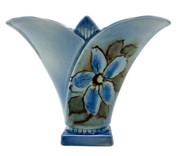 Jens Jensen, Rookwood Pottery: A flared vase by Rookwood Pottery, decorated by Jens Jensen with magnolias, shape 6816A, dated 1946. Signed and marked to the underside. Ht. 8".