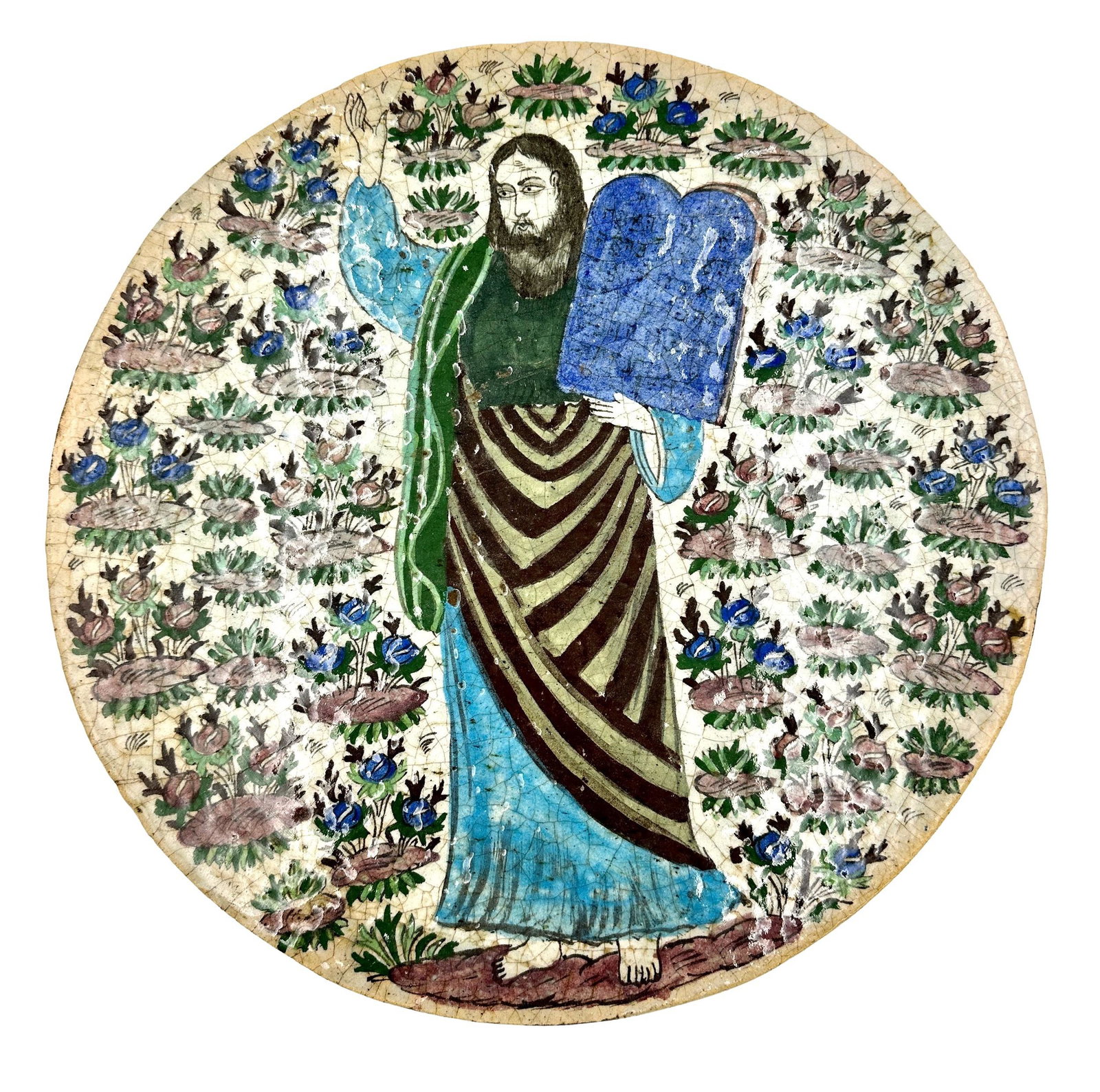 Middle Eastern Plaque with Biblical Moses: 19th century, a circular tile/plaque depicting Moses and the ten commandments, surrounded flowers and foliage, 15" diam.