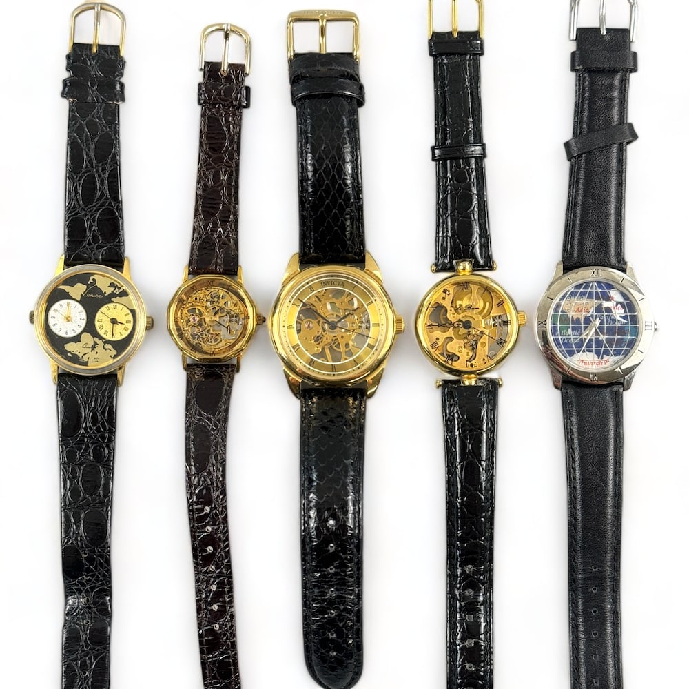 Group of 5 Skeleton / World Wristwatches: Including one Invicta, one Cruce, one La Baron and additional, all with leather bands.