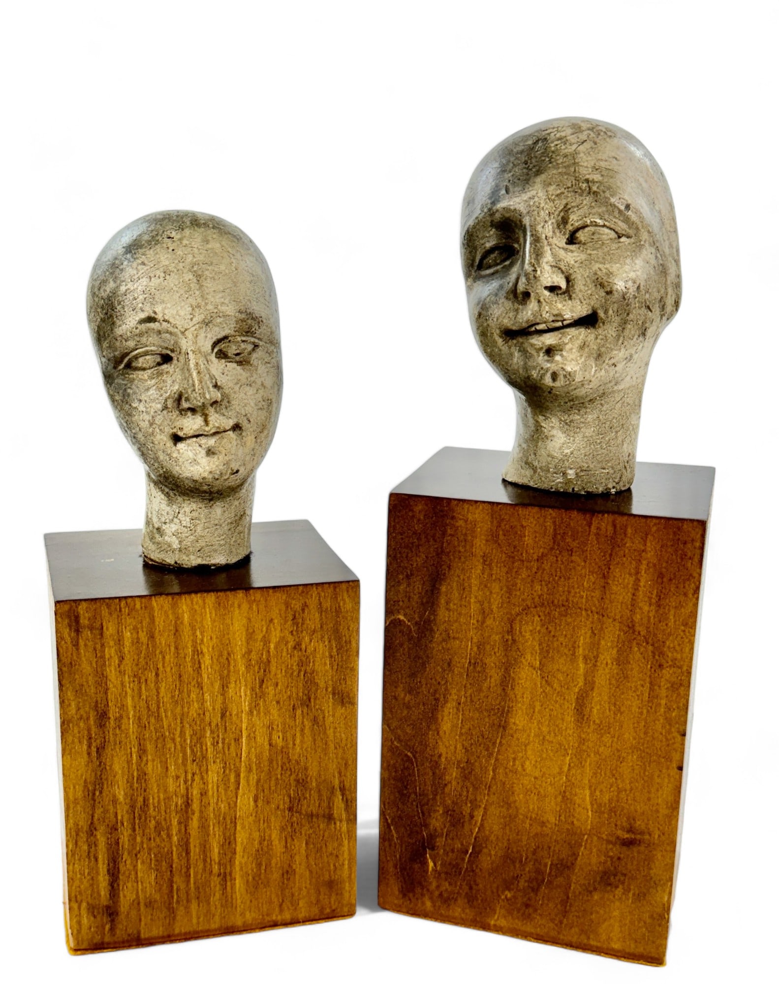 Pair of Modernist Bust Sculptures: Each on wood base, comprising two painted busts. Tallest 13" ht. From the collection of Ann M. Meranus, Cincinnati, OH. Ann was a lifelong philanthropist, civil
