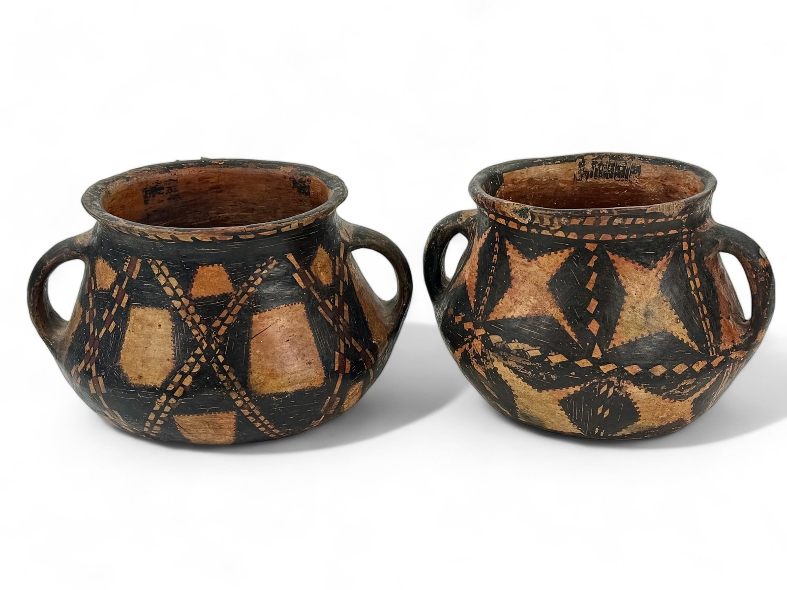 Pair of Pre-Columbian Two-Handles Vessels: Both with black and red patchwork decoration in the round, two handles. 5.5" ht. x 9.5" diam. From the collection of Ann M. Meranus, Cincinnati, OH. Ann was a li