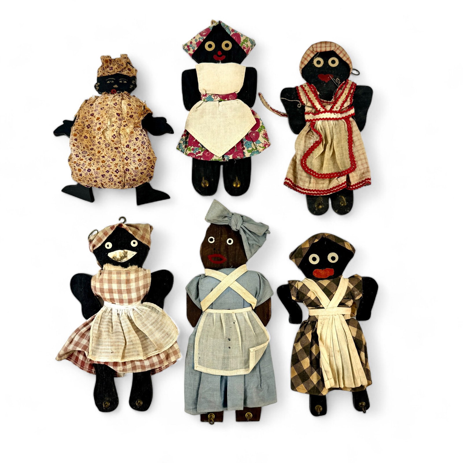 Folk Art Wood and Cloth Mammy Dolls and Hangers: Six in total, all with custom made clothing and hand painted. Most with hooks designed to hang everyday kitchen items. Tallest is 11.5" ht.