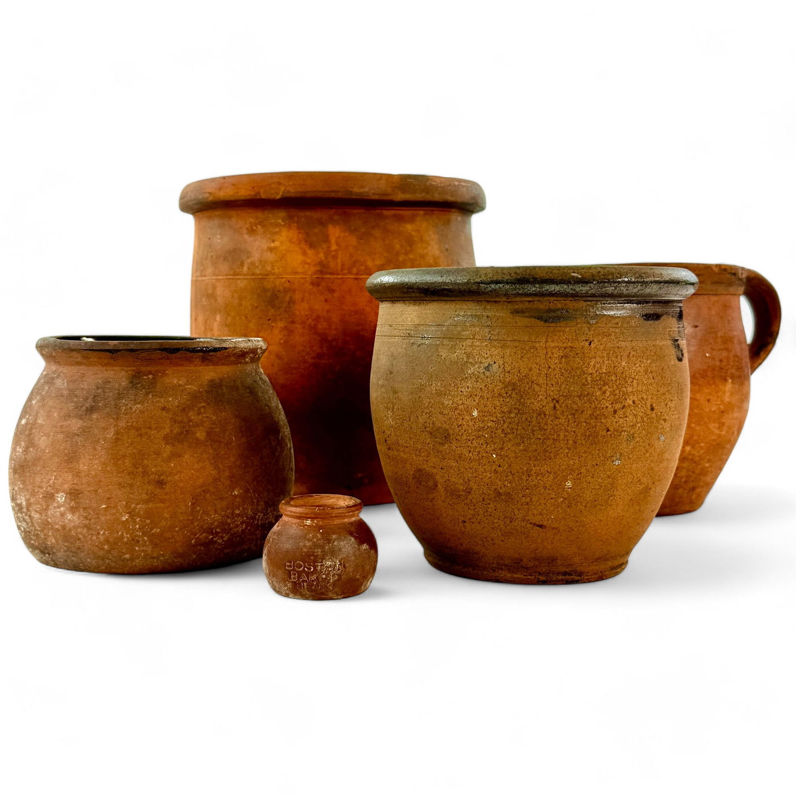 Five (5) American Redware Vessels: Pottery group. Including one handled jug. Tallest 8.5" ht.