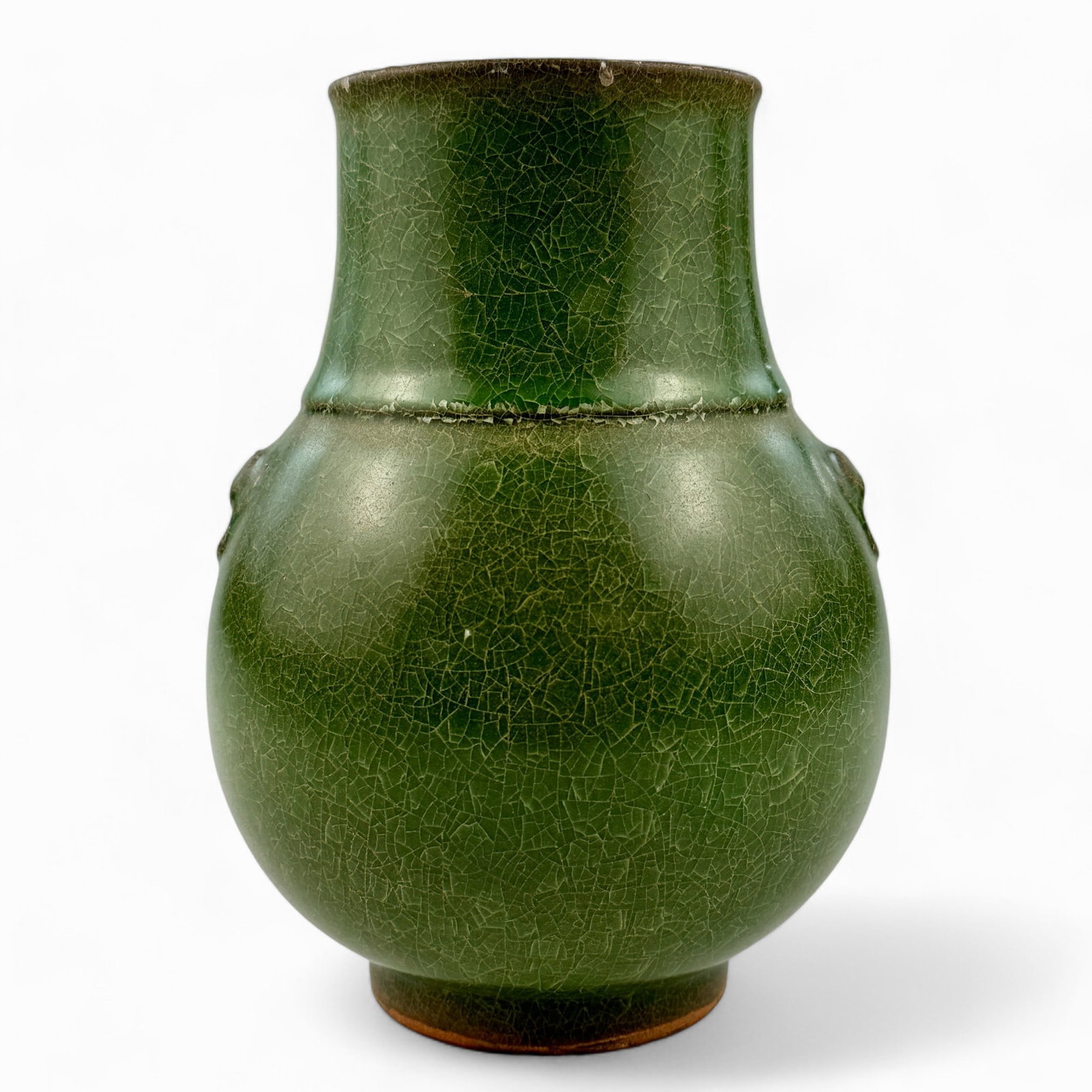 Chinese Vase in Green Glaze: Chinese, likely 19th century but in a Han pottery form, with low relief beast handles and rings incorporated into the form, unmarked, and crackle glaze. Ht. 7.75".